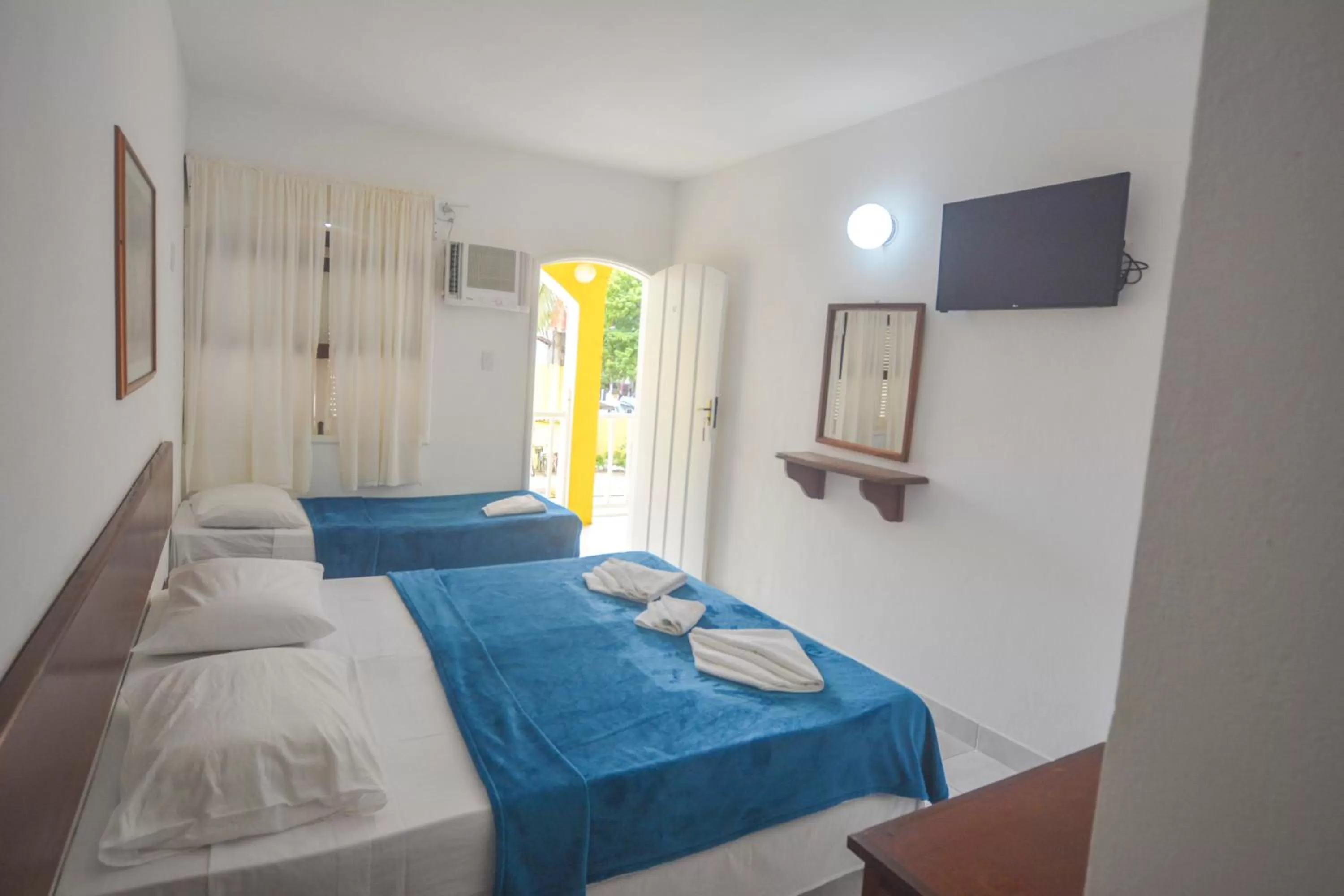 Bed in Pousada Estrela de Paraty