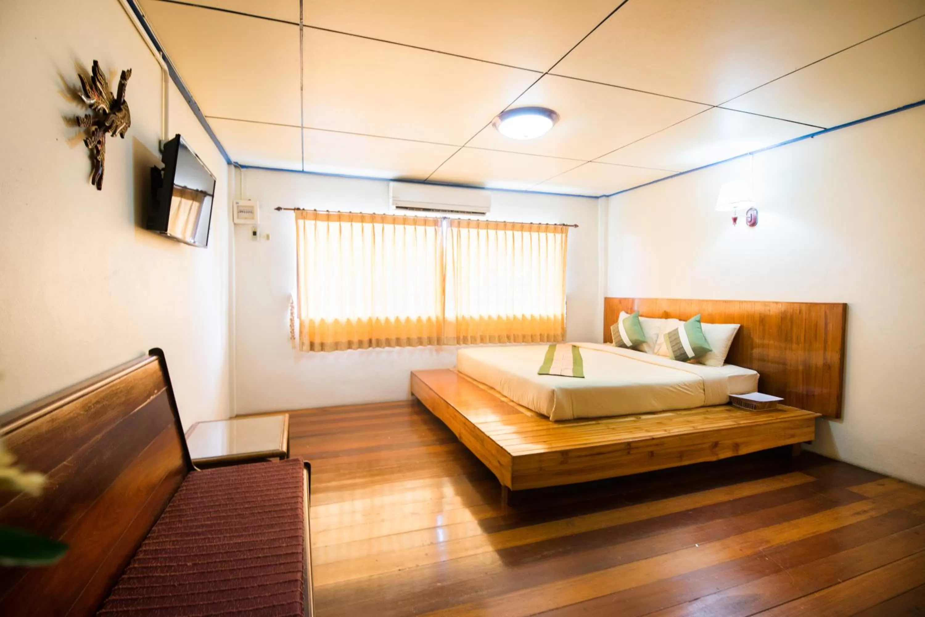 Photo of the whole room, Bed in Pongphen Guesthouse - SHA Plus Certified