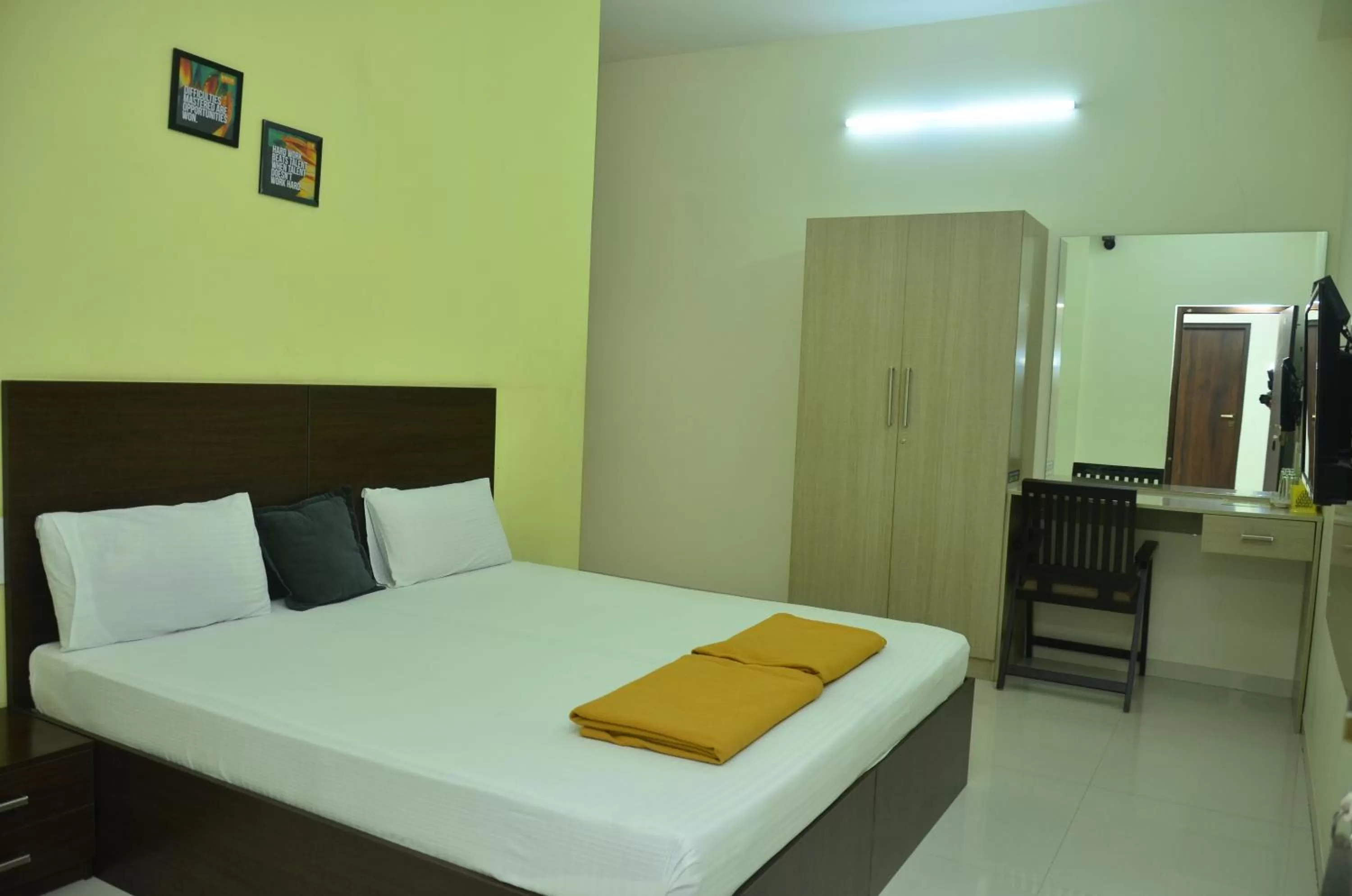 Bed in THE SURRYA MAX RESIDENCY