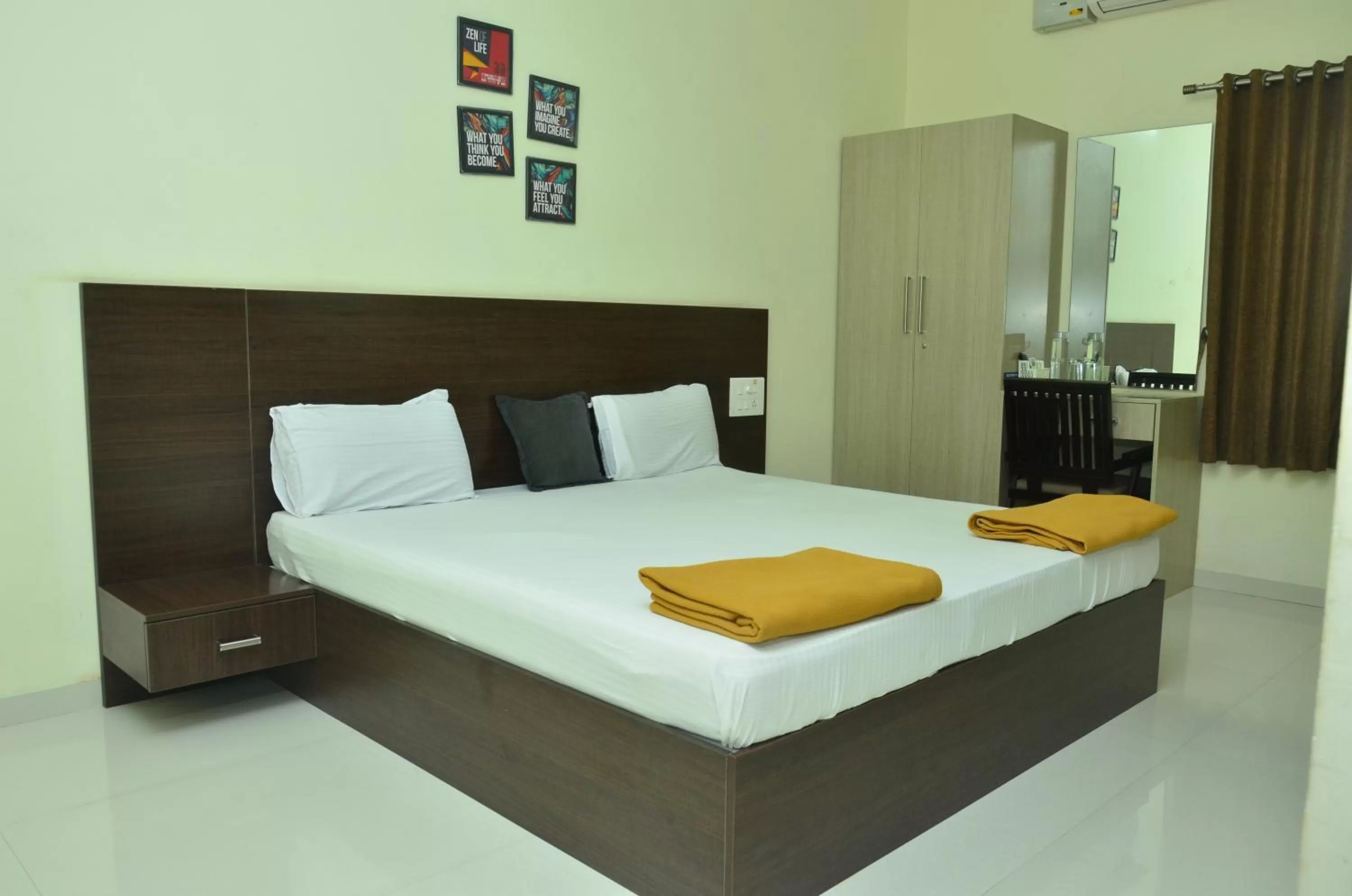 Bed in THE SURRYA MAX RESIDENCY