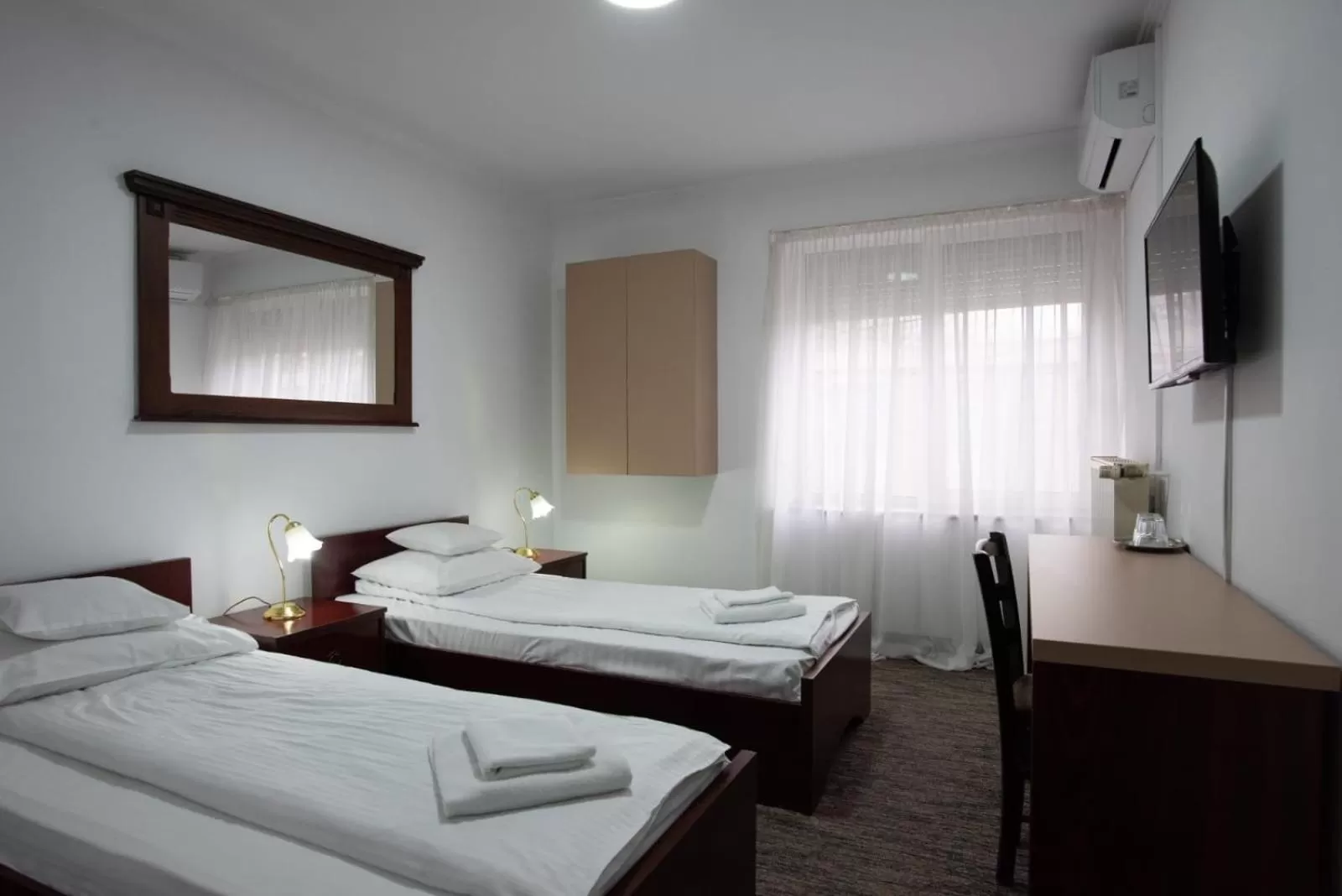 Bed in Carnival City Hotel Oradea
