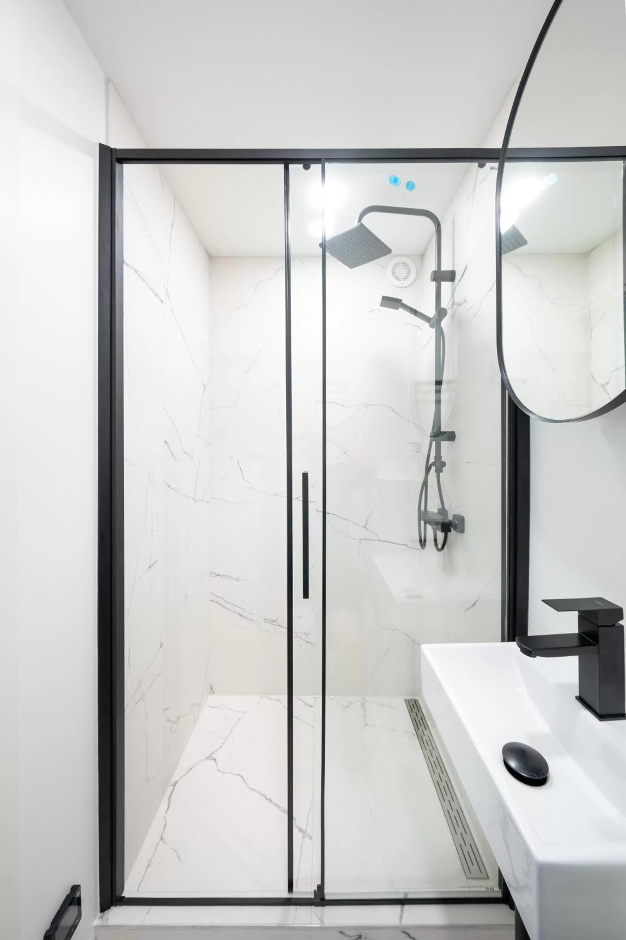 Shower in Oasis Airport Studios by RevalHome