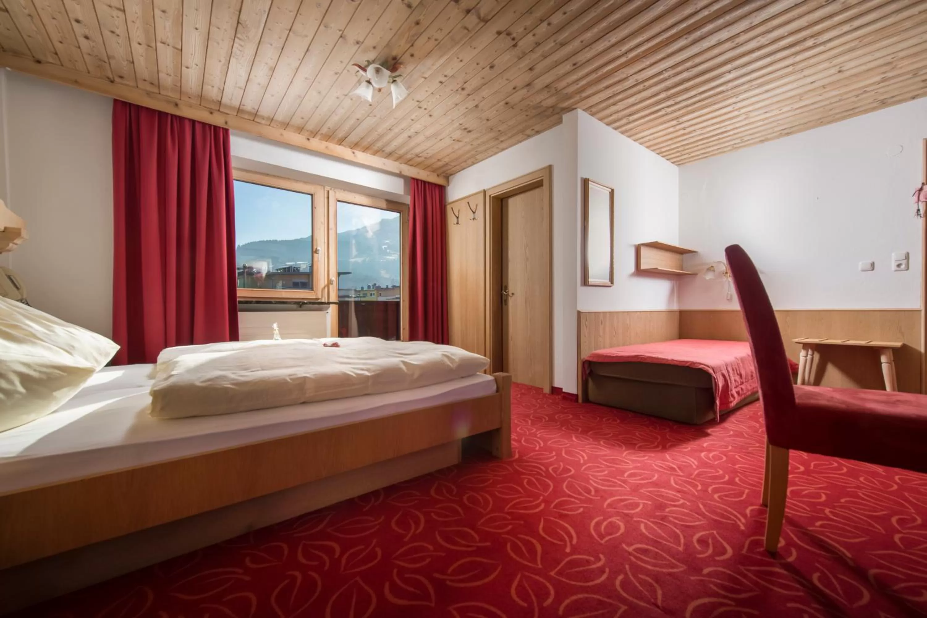 Photo of the whole room, Bed in Familienhotel Central