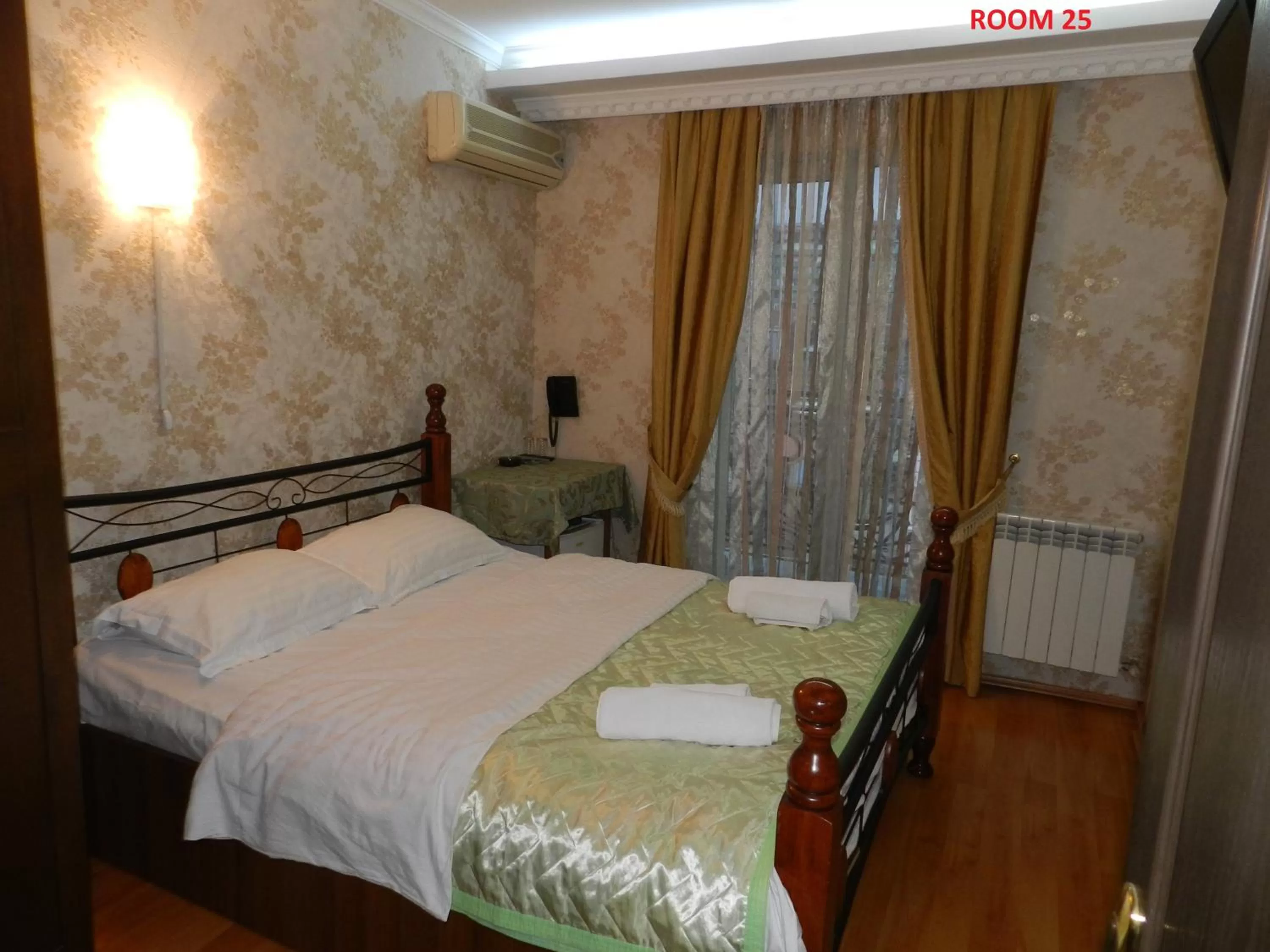 Bed in Hotel Elegant Garden