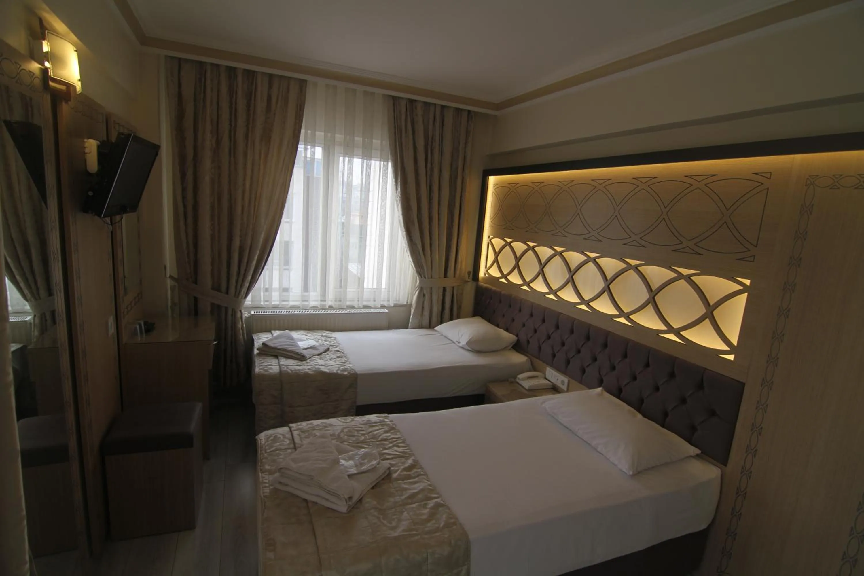 Bed in Grand Liza Hotel