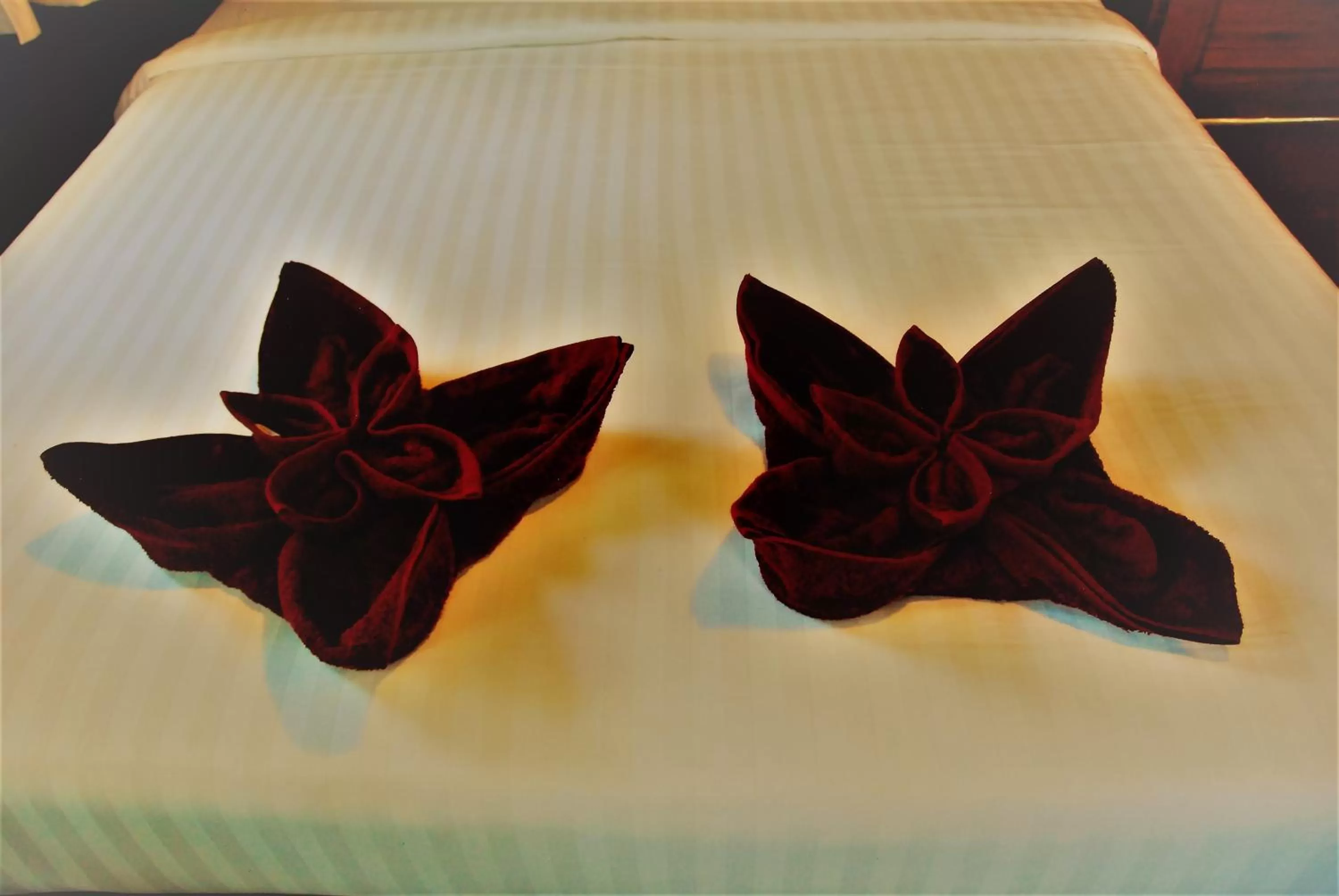 Bed in Cozy Garden Resort