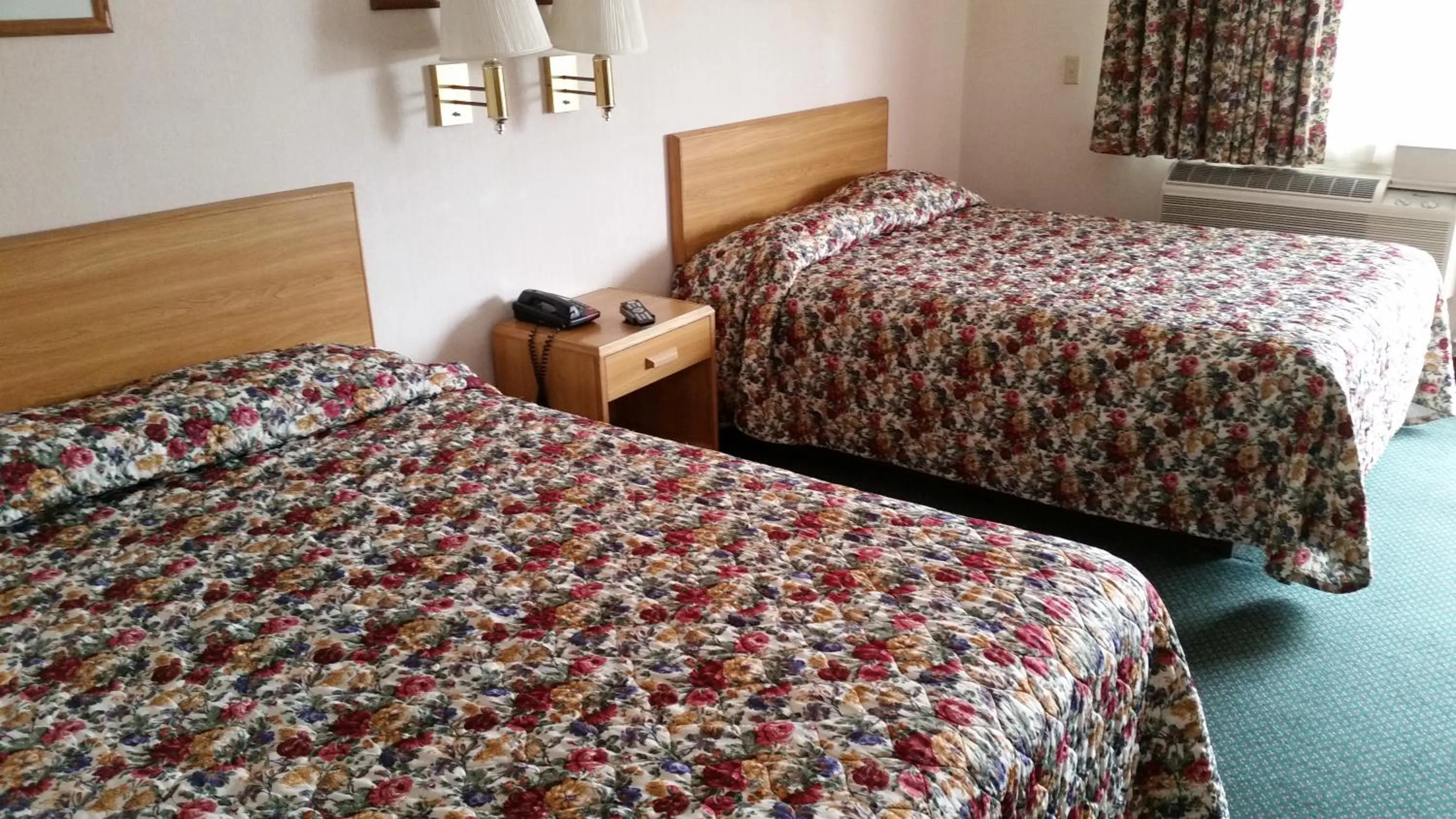 Bed in Economy Inn Motel