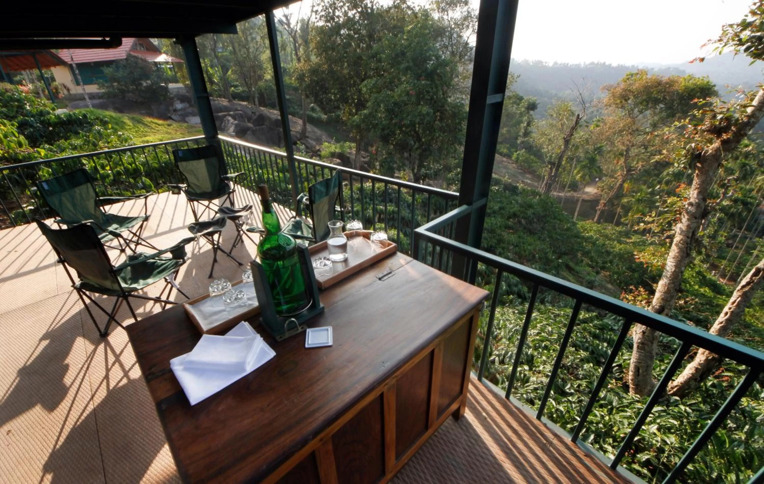 Seating area, Balcony/Terrace in Marmalade Springs Resort Wayanad