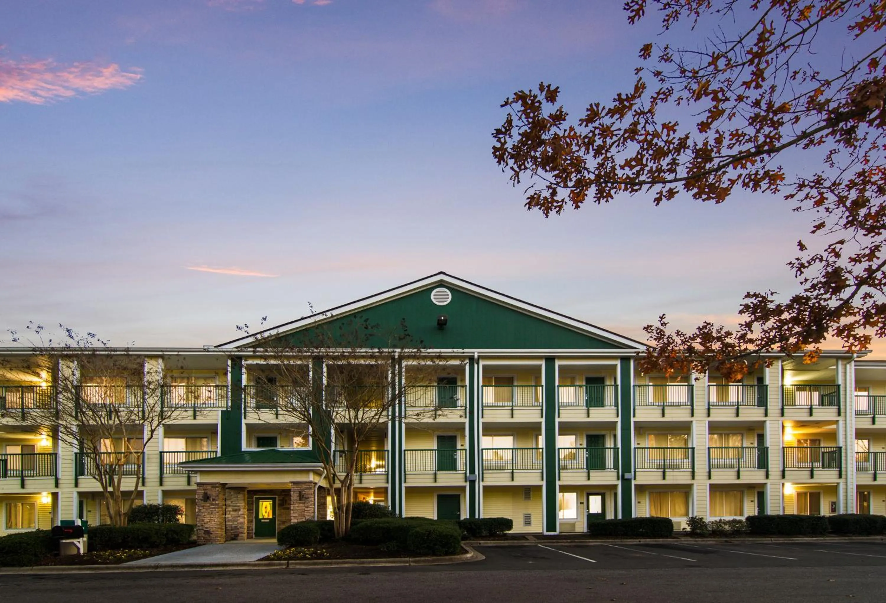 Property building in HomeTowne Studios by Red Roof Raleigh – Durham