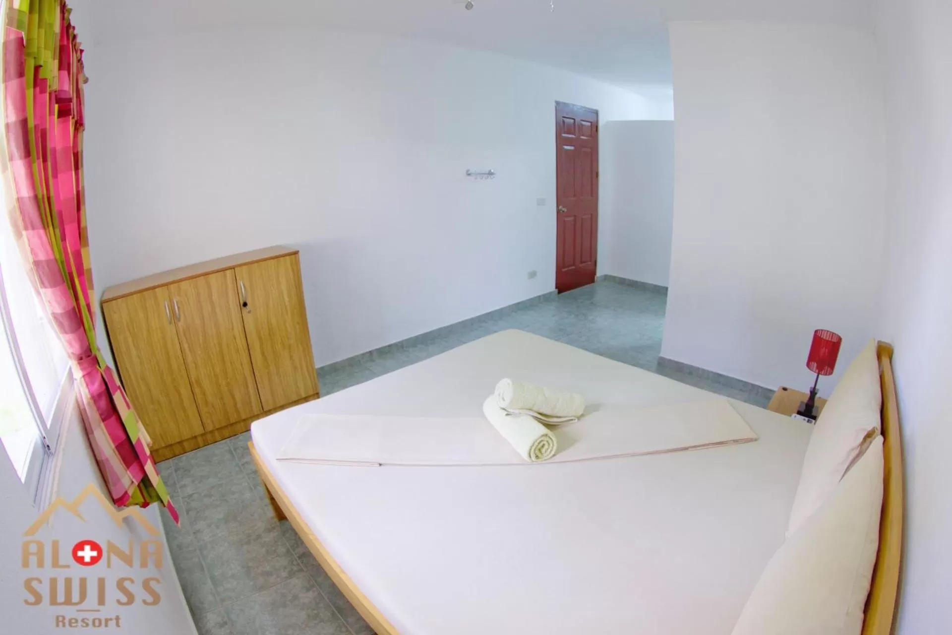 Bed in Alona Swiss Resort