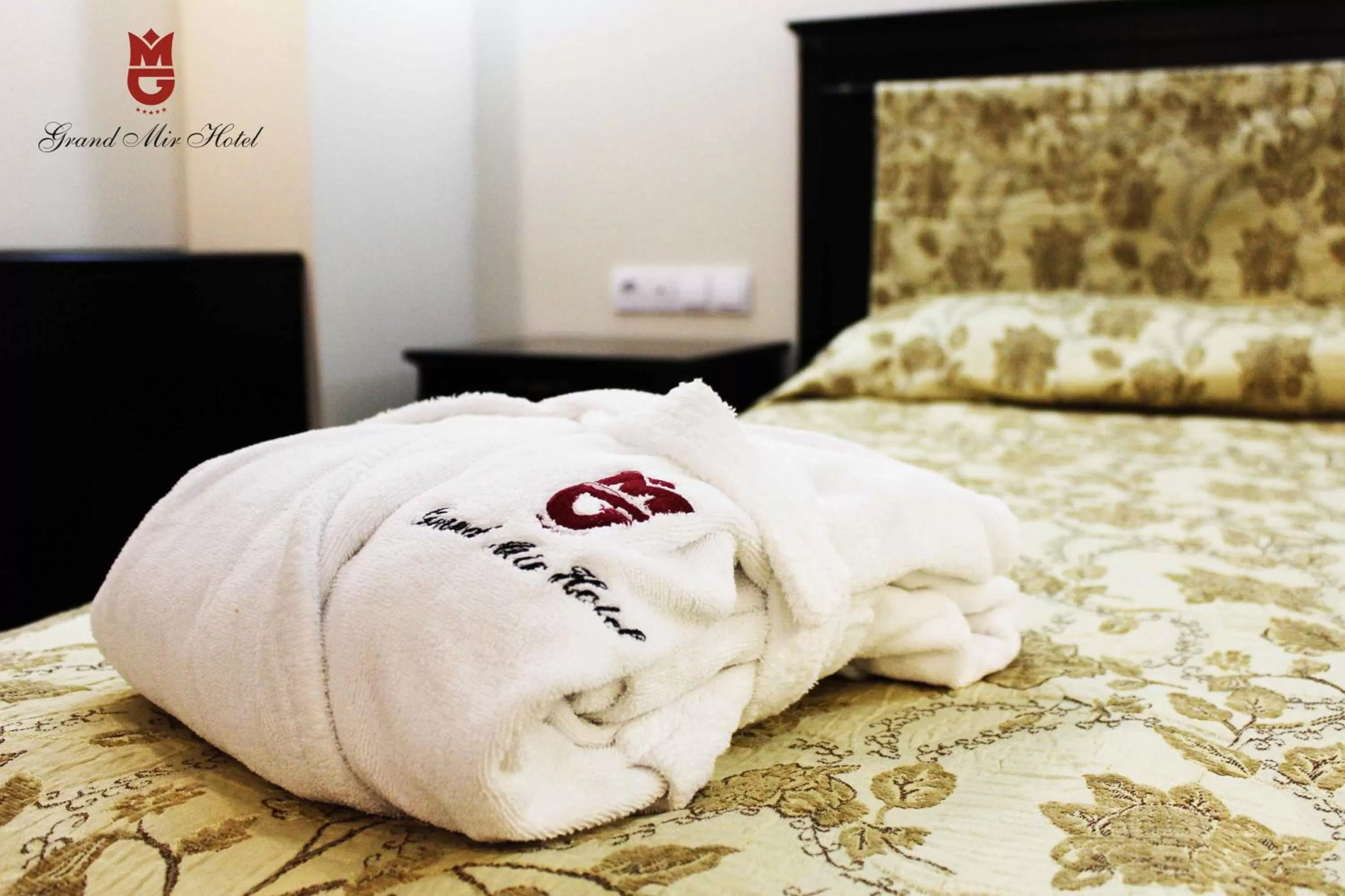 Bed in Grand Mir Hotel