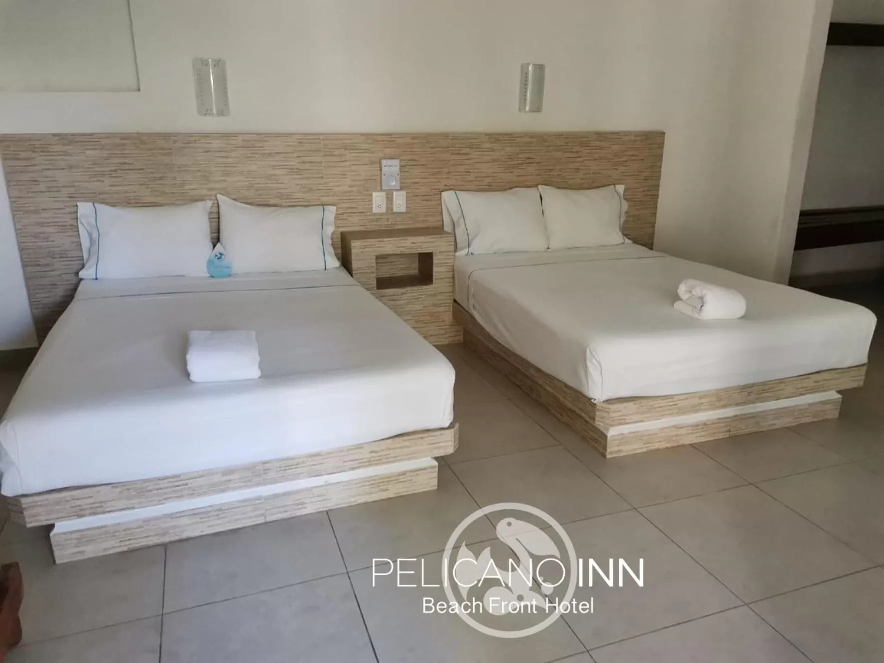 Bed in Pelicano Inn Playa del Carmen - Beachfront Hotel