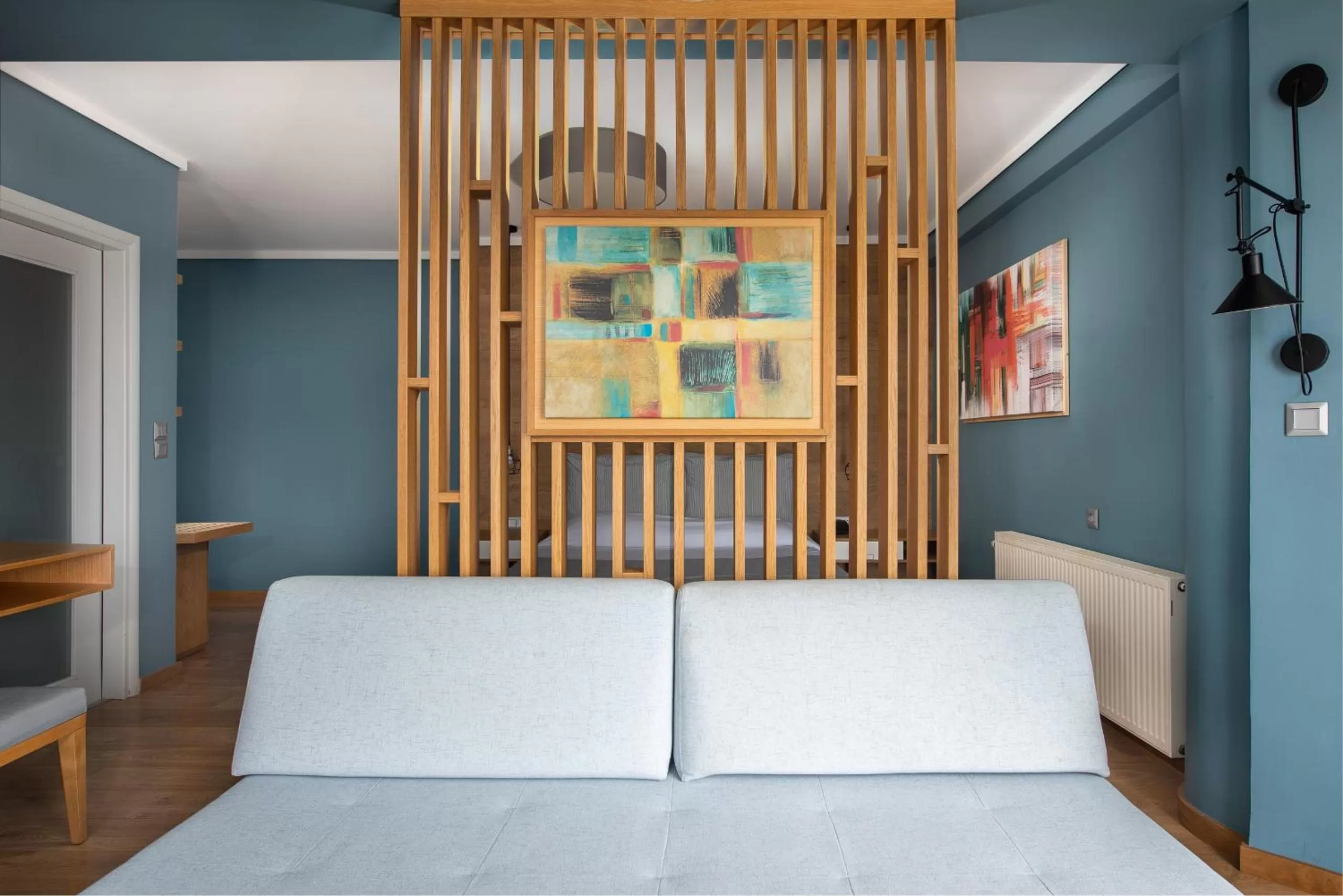 Living room, Bed in Heliotrope Hotels