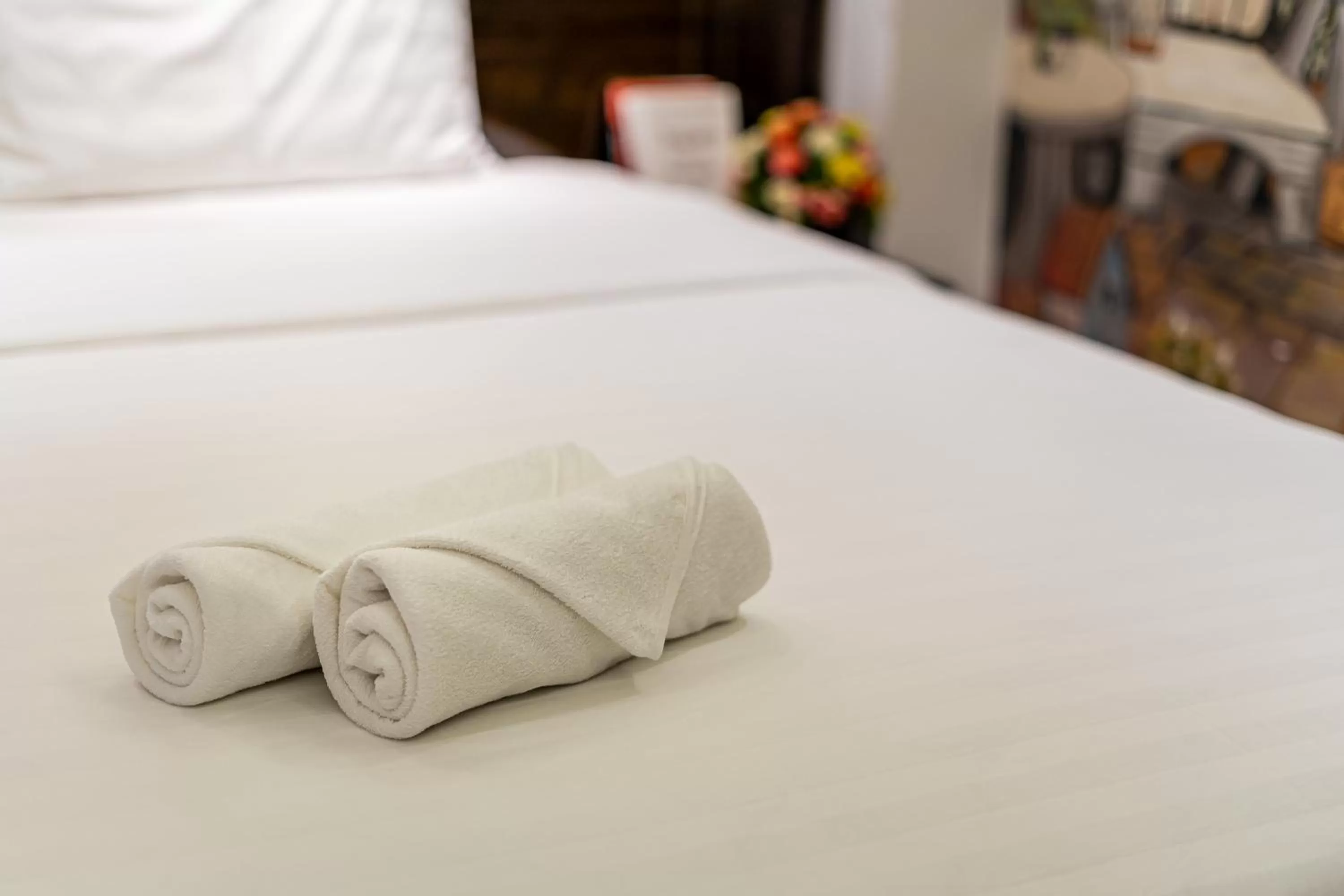 Bed in Lotus Laverne Hotel