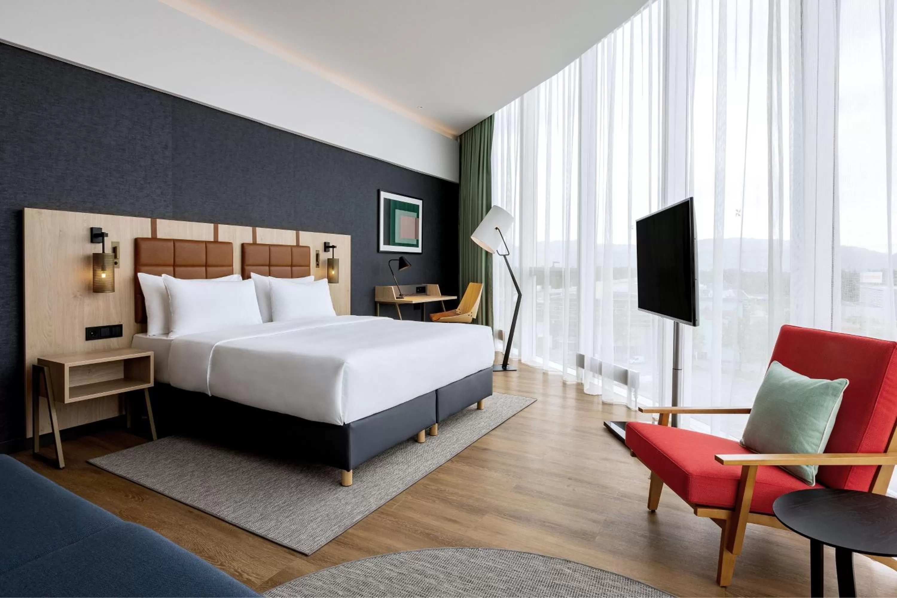 Photo of the whole room, Bed in Four Points by Sheraton Panoramahaus Dornbirn