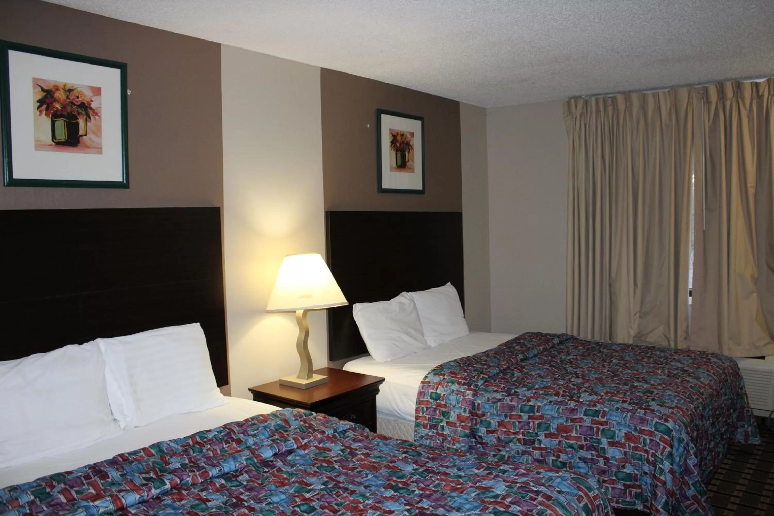 Bedroom, Bed in Coratel Inn and Suites Maple Grove