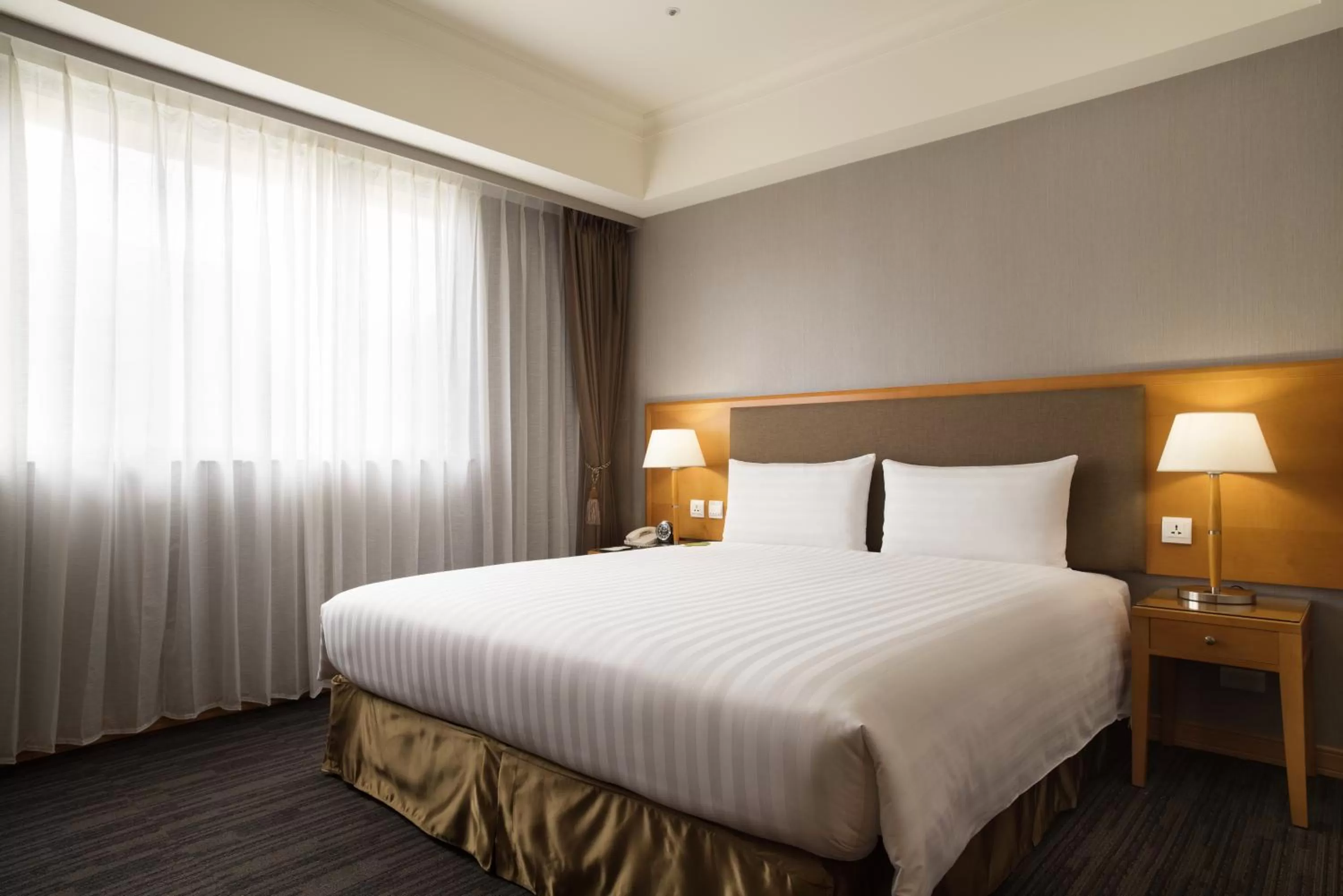 Bed in Fushin Hotel Taipei