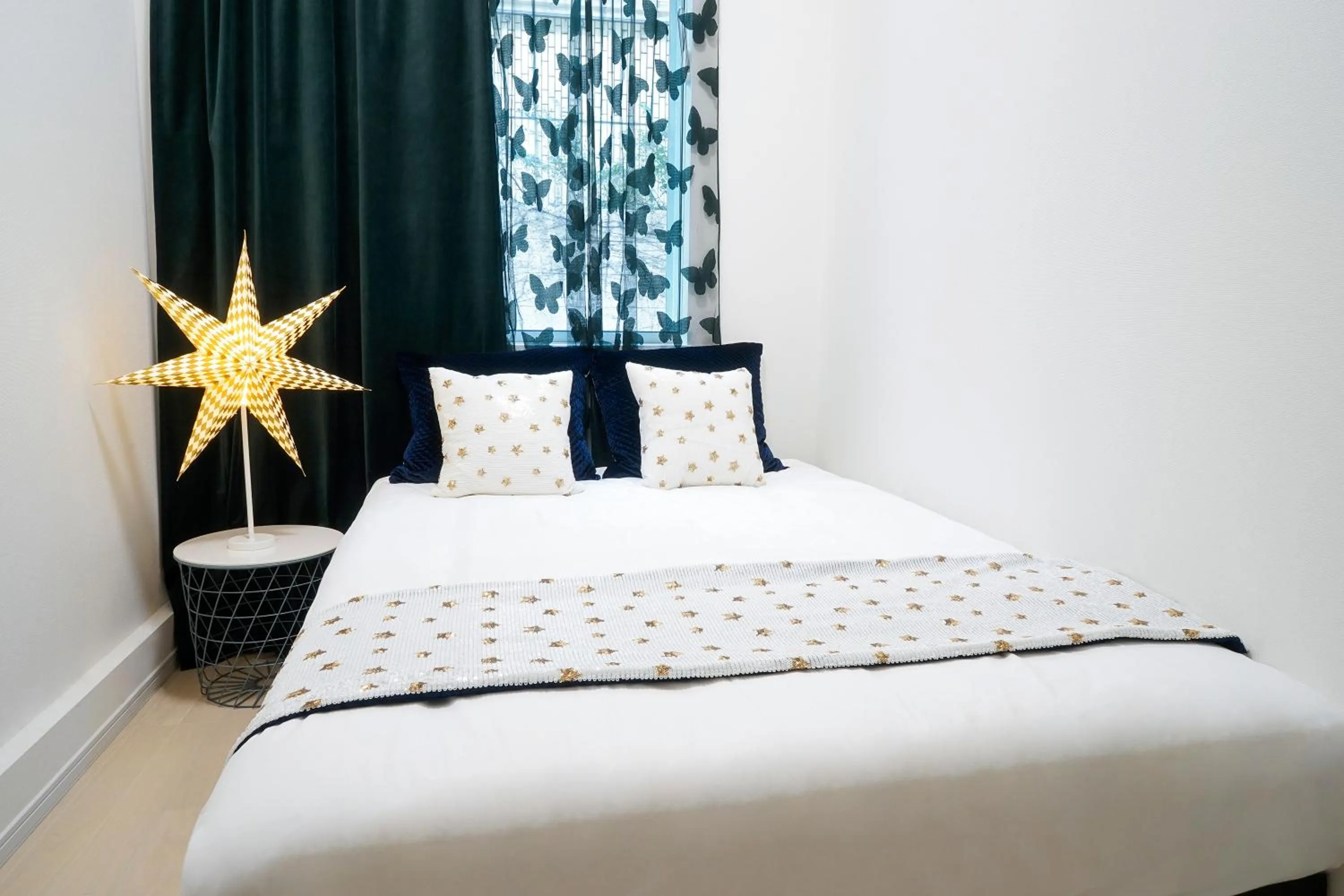 Bed in Blue Empire Hotel