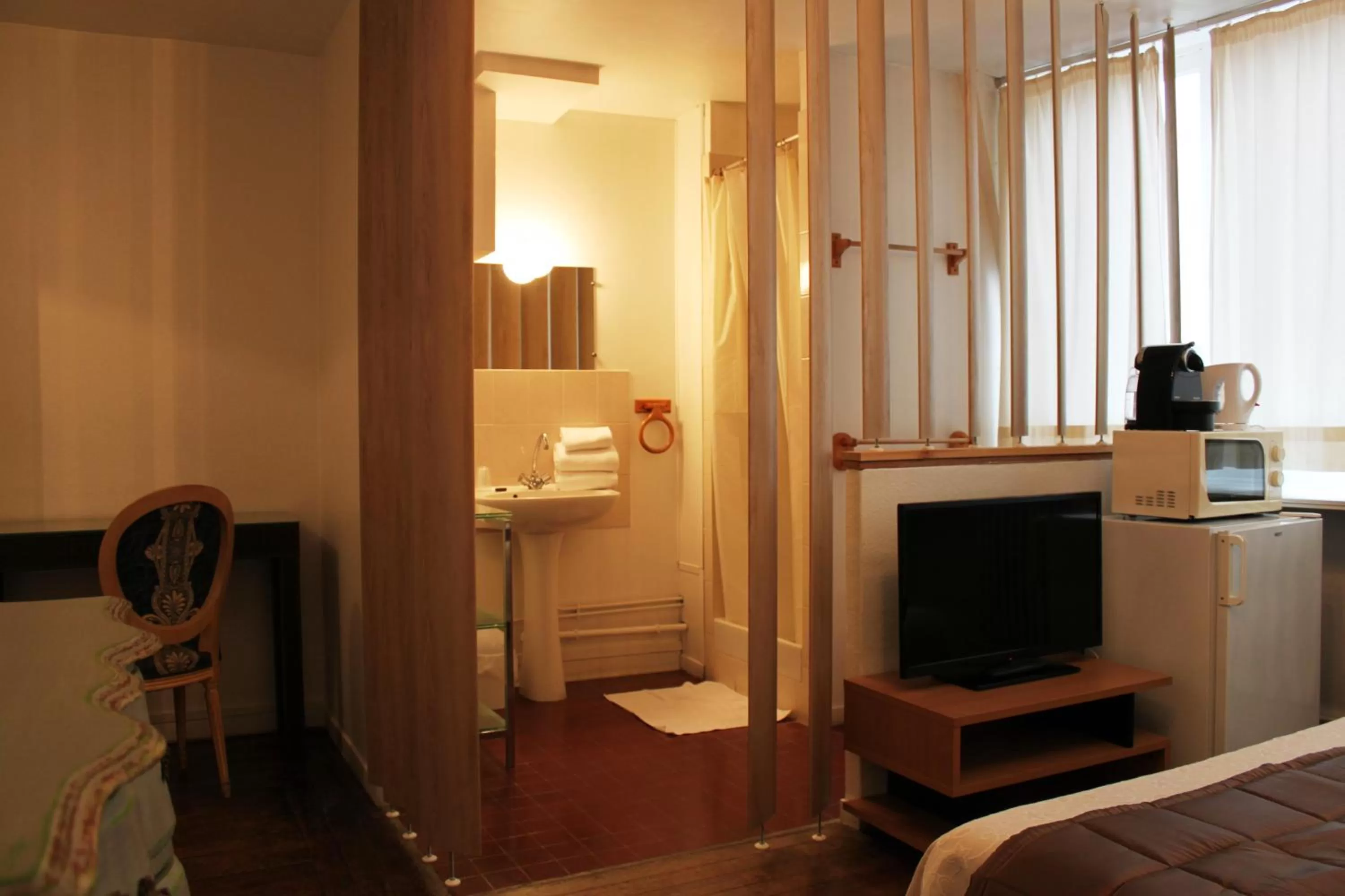 TV/Entertainment Center in Résidence et Chambres d'Hôtes de La Porte d'Arras