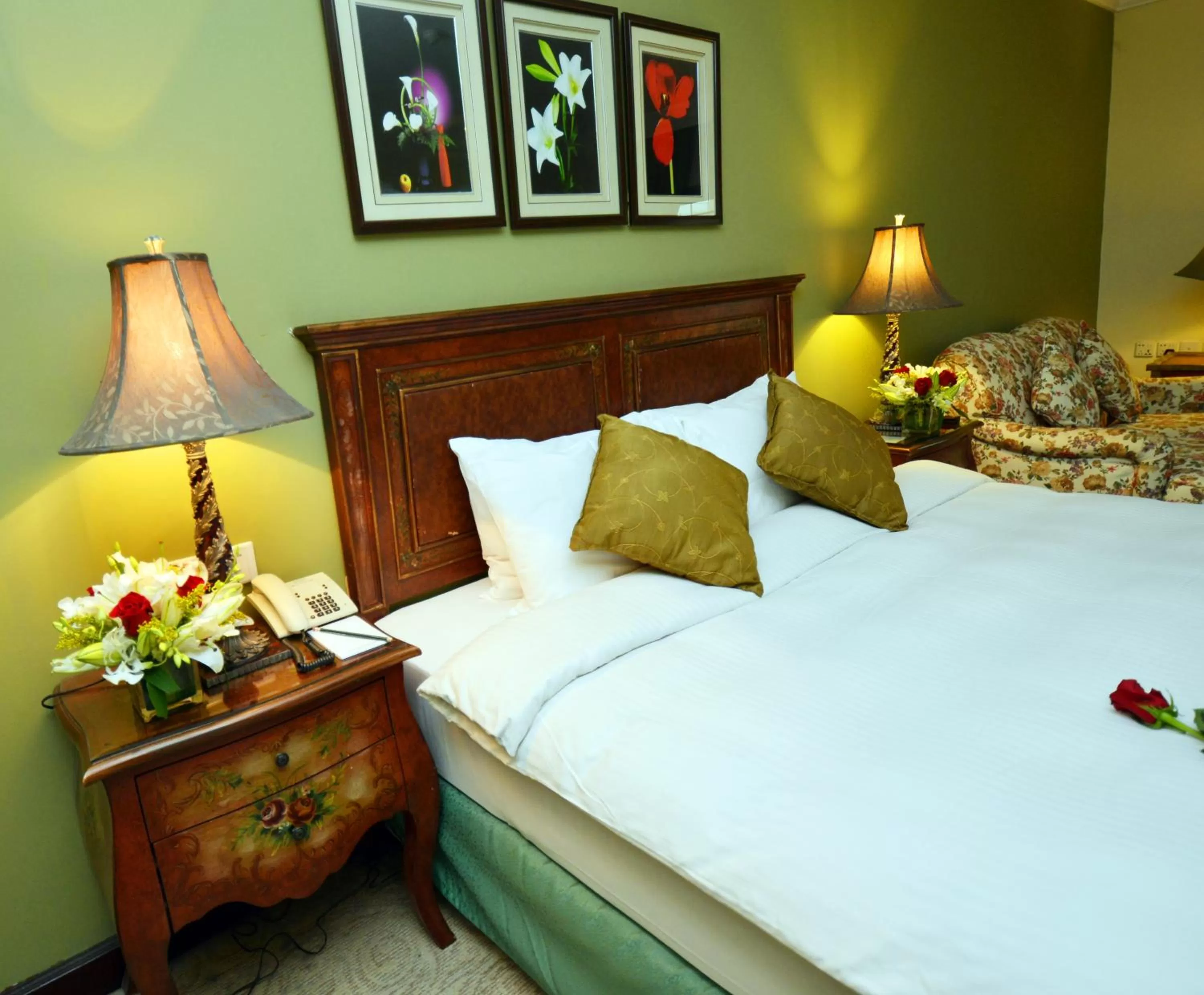 Bed in The Convention Center & Royal Suites Hotel