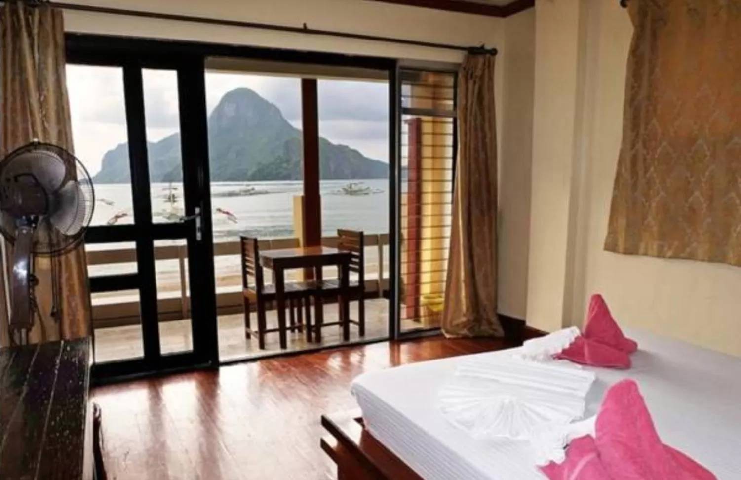 Balcony/Terrace, Bed in El Nido Beach Hotel