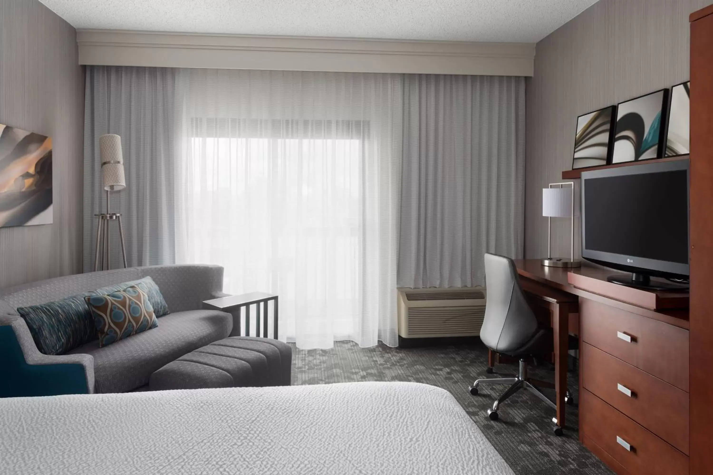 Newly Redesigned King Room with Sofa Bed and Adapted Tub - Mobility and Hearing Accessible in Courtyard Syracuse Carrier Circle Newly Redesigned King Room with Sofa Bed and Adapted Tub - Mobility and Hearing Accessible in Courtyard Syracuse Carrier Circle