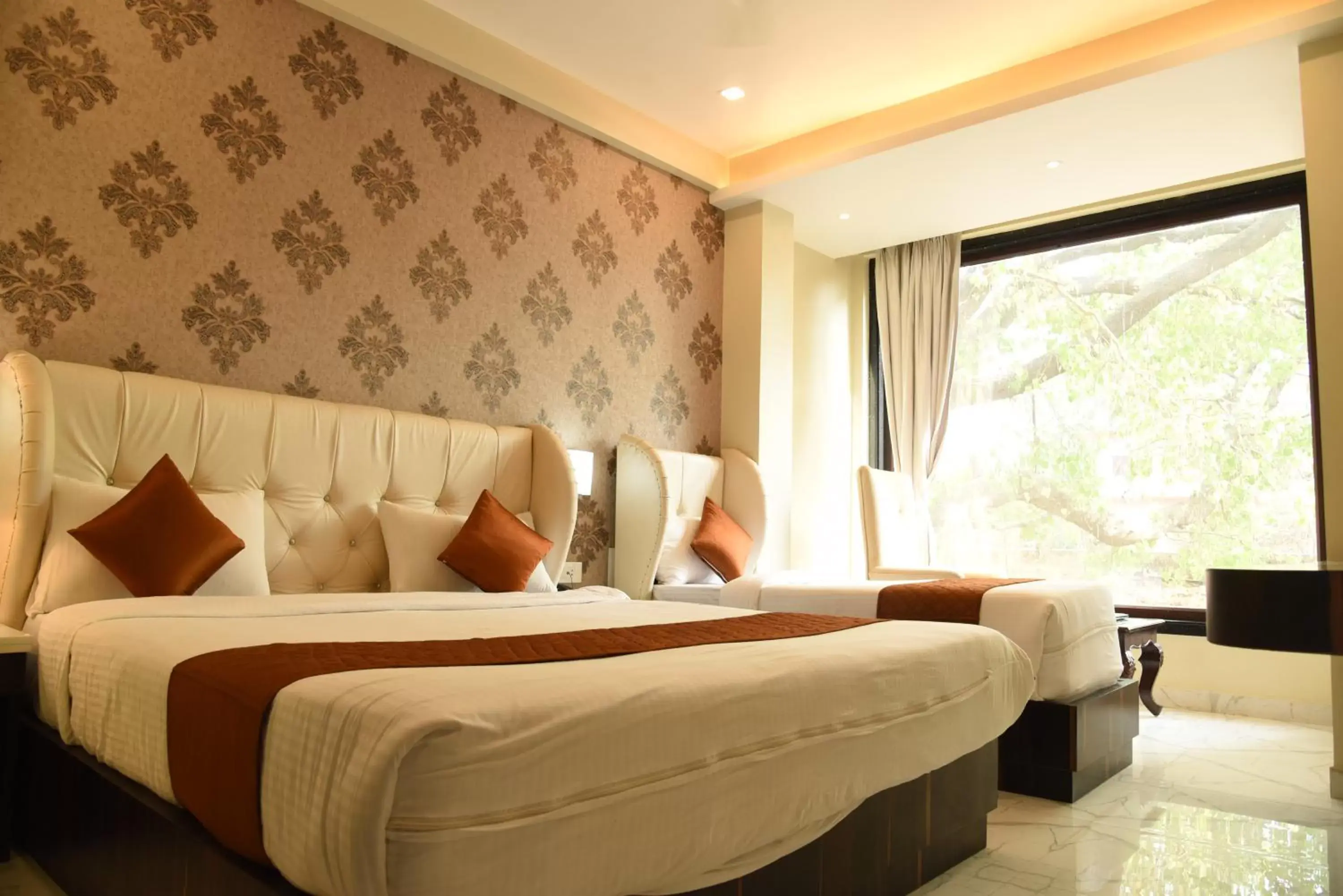 Executive Triple Room (Evening Aarti with Boat Ride @ INR 500 Per Person) in Hotel Heritage Inn at Assi Ghat Executive Triple Room (Evening Aarti with Boat Ride @ INR 500 Per Person) in Hotel Heritage Inn at Assi Ghat