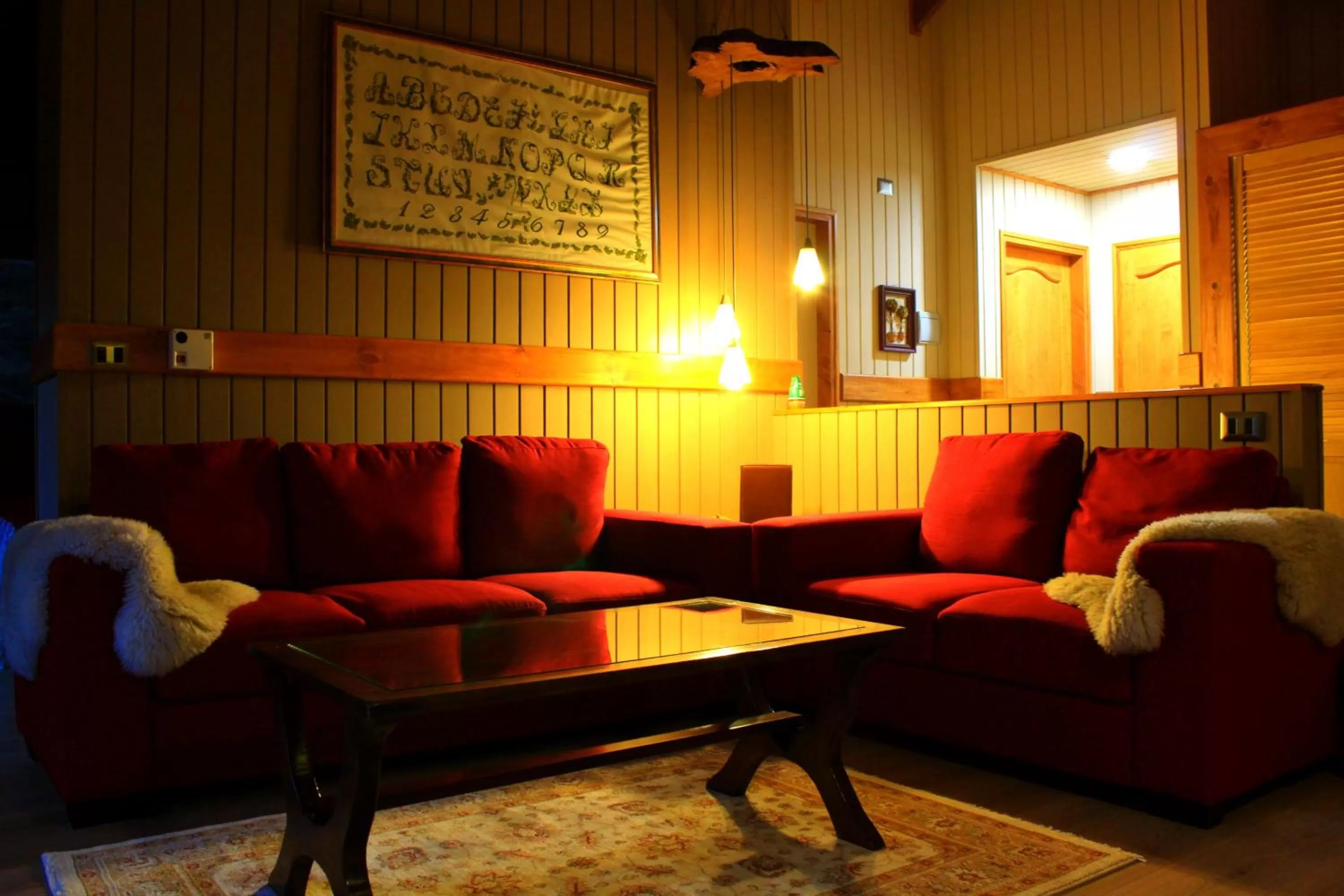 Living room, Lounge/Bar in Hotel Salto del Carileufu