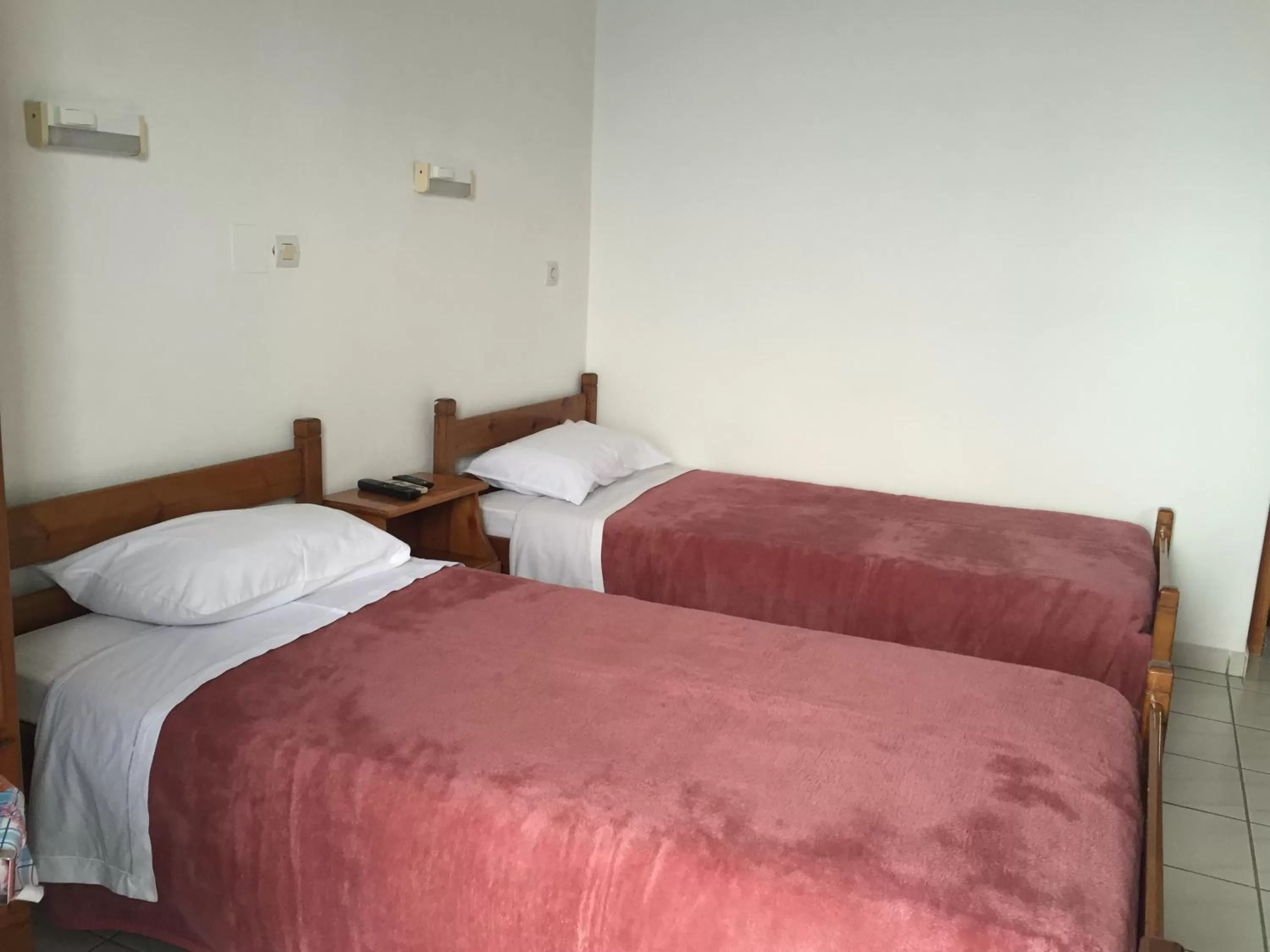 Bed in Angelos Hotel