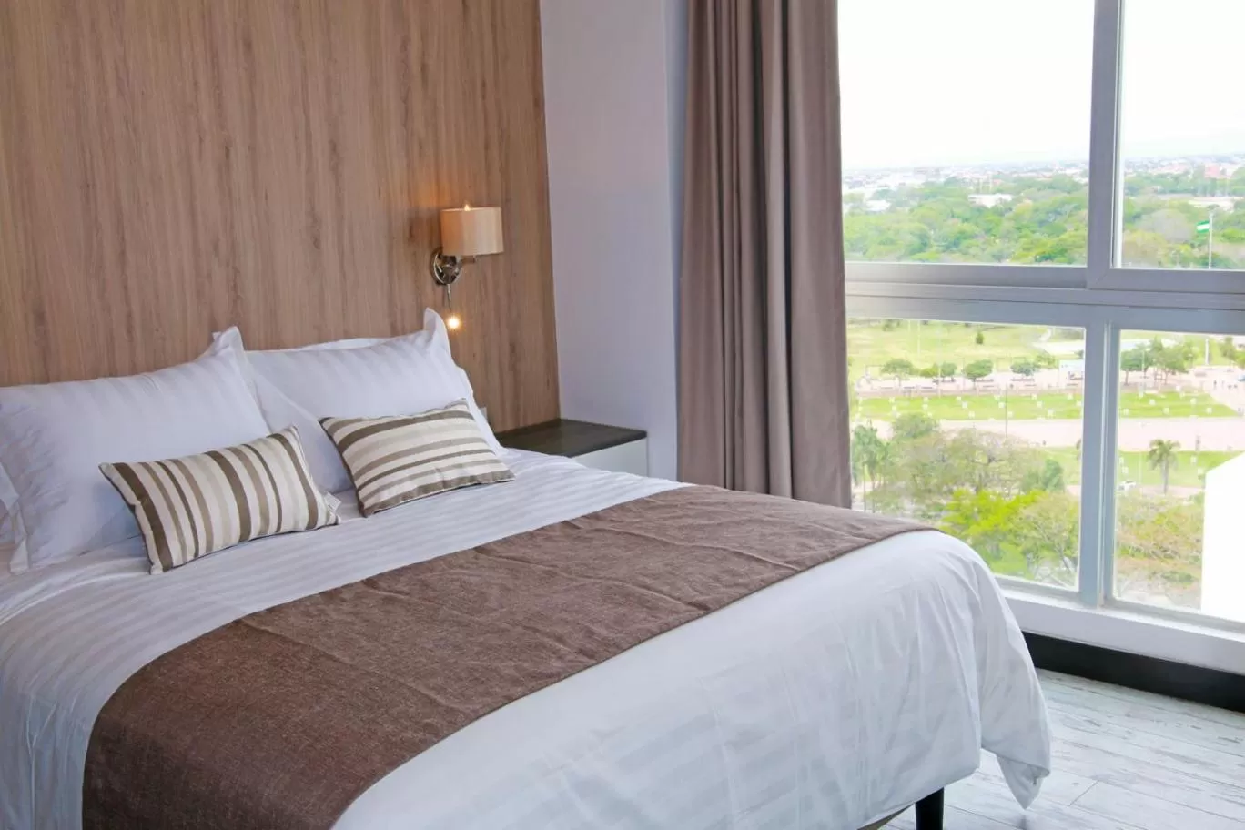 Bed in Urban Suites Apart Hotel