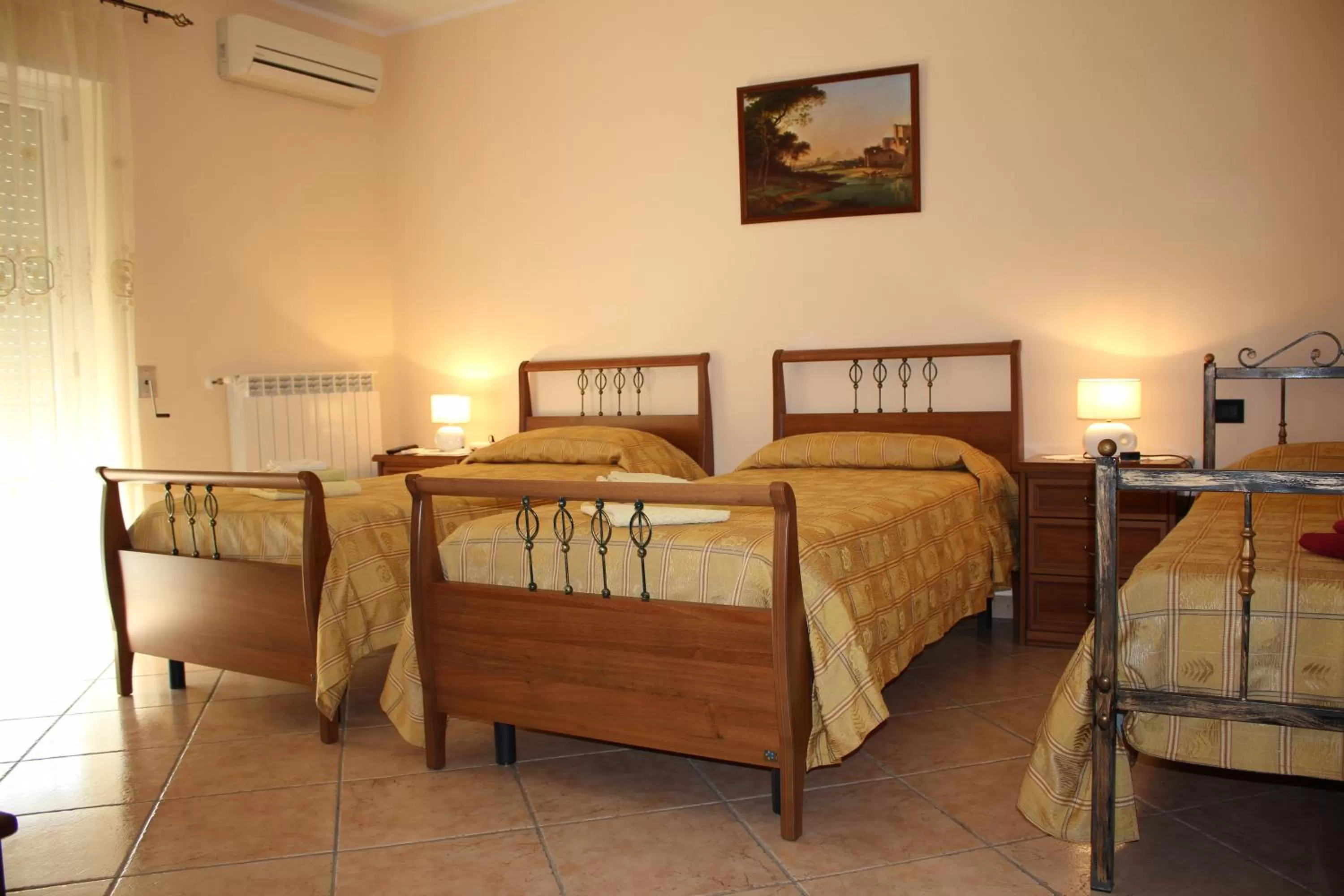 Quadruple Room with Balcony in B&B Esperança