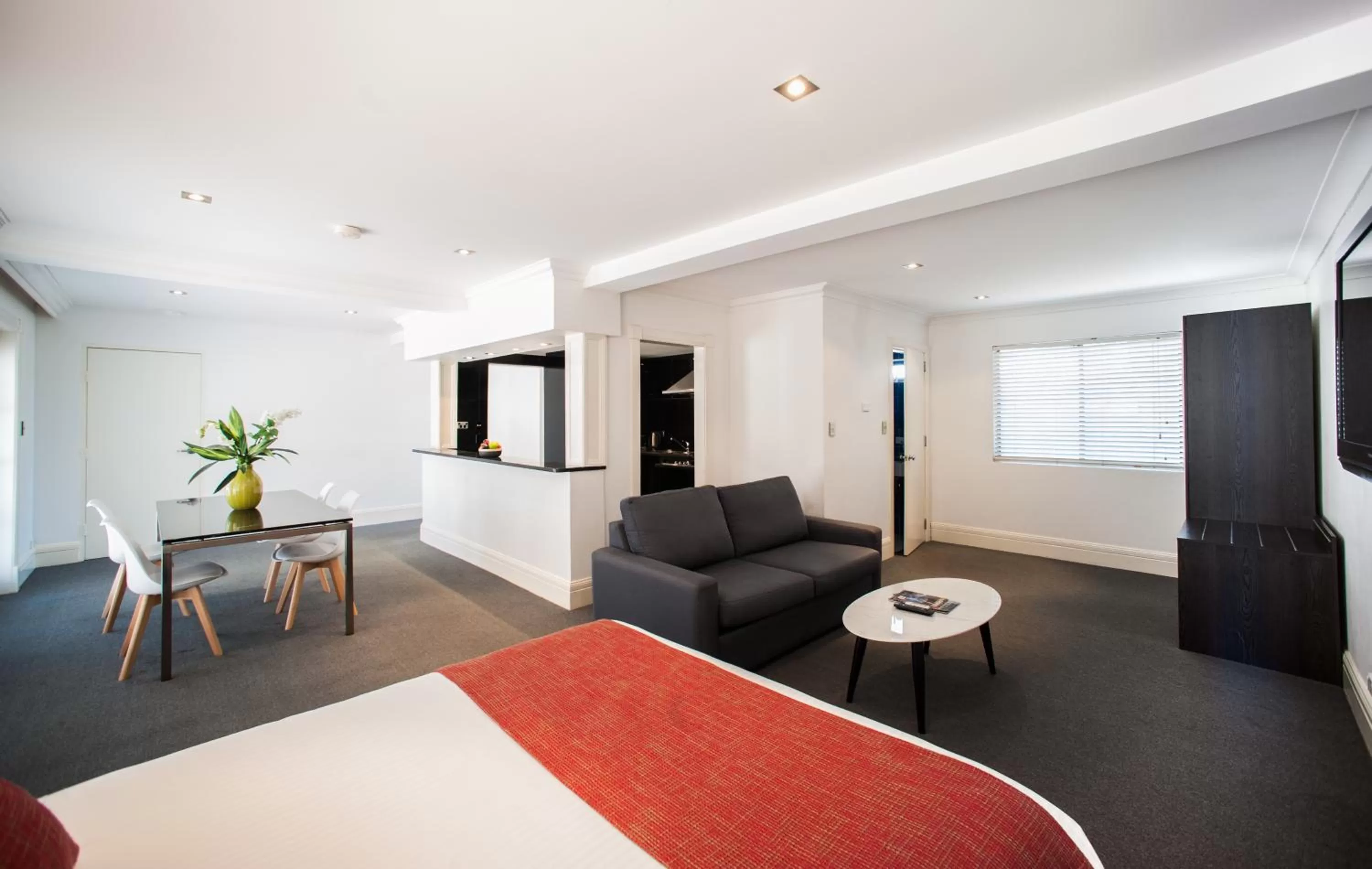 Living room, Bed in Ramada Hotel & Suites by Wyndham Cabramatta