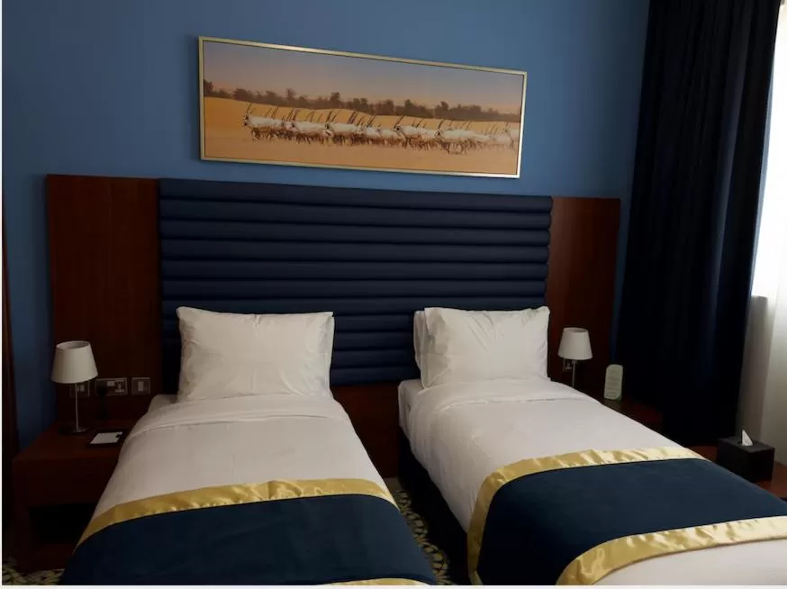 Kitchen or kitchenette, Bed in BANIYAS PLAZA HOTEL APARTMENTS