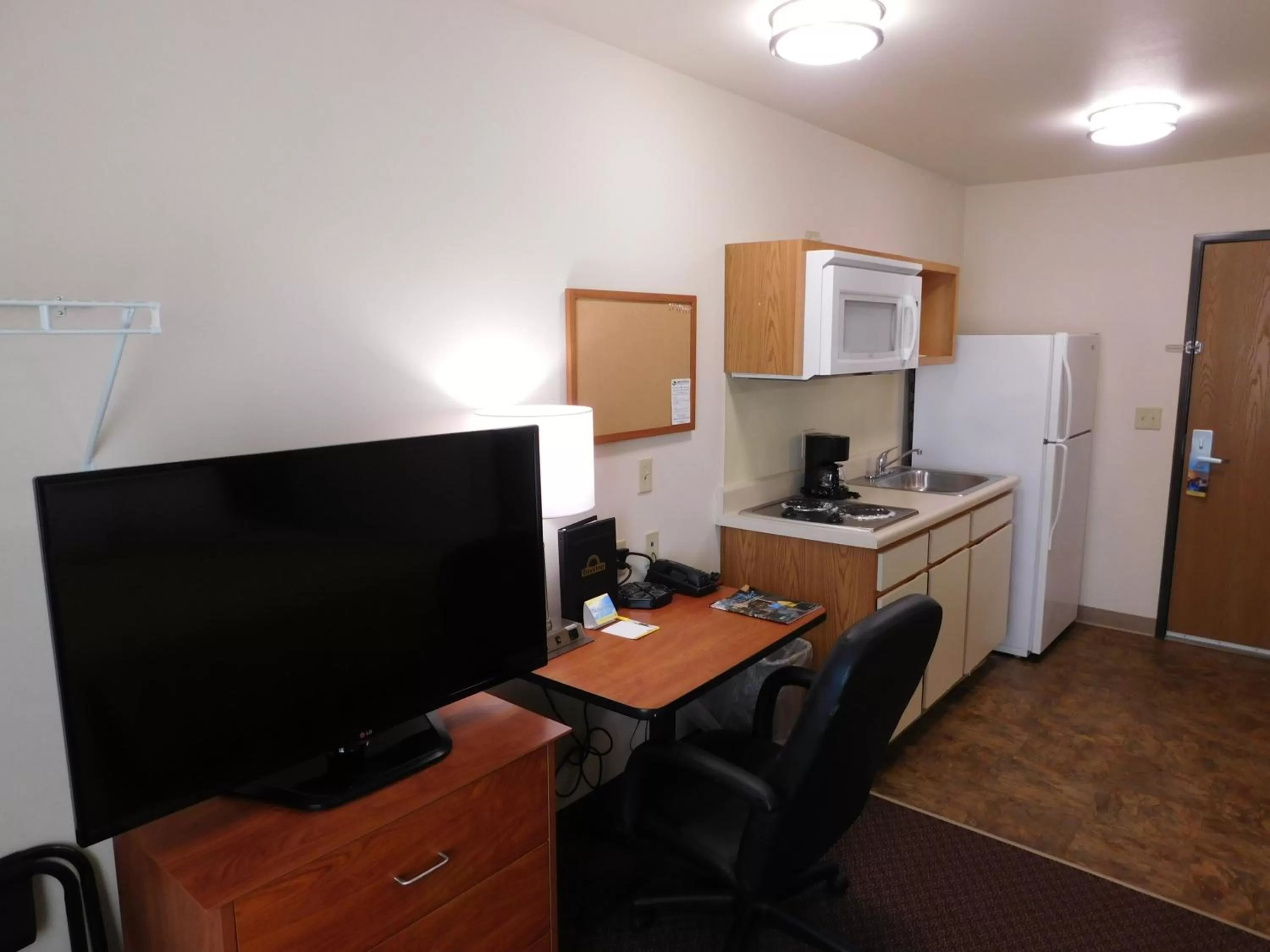 Kitchen or kitchenette in Days Inn & Suites by Wyndham Rochester South