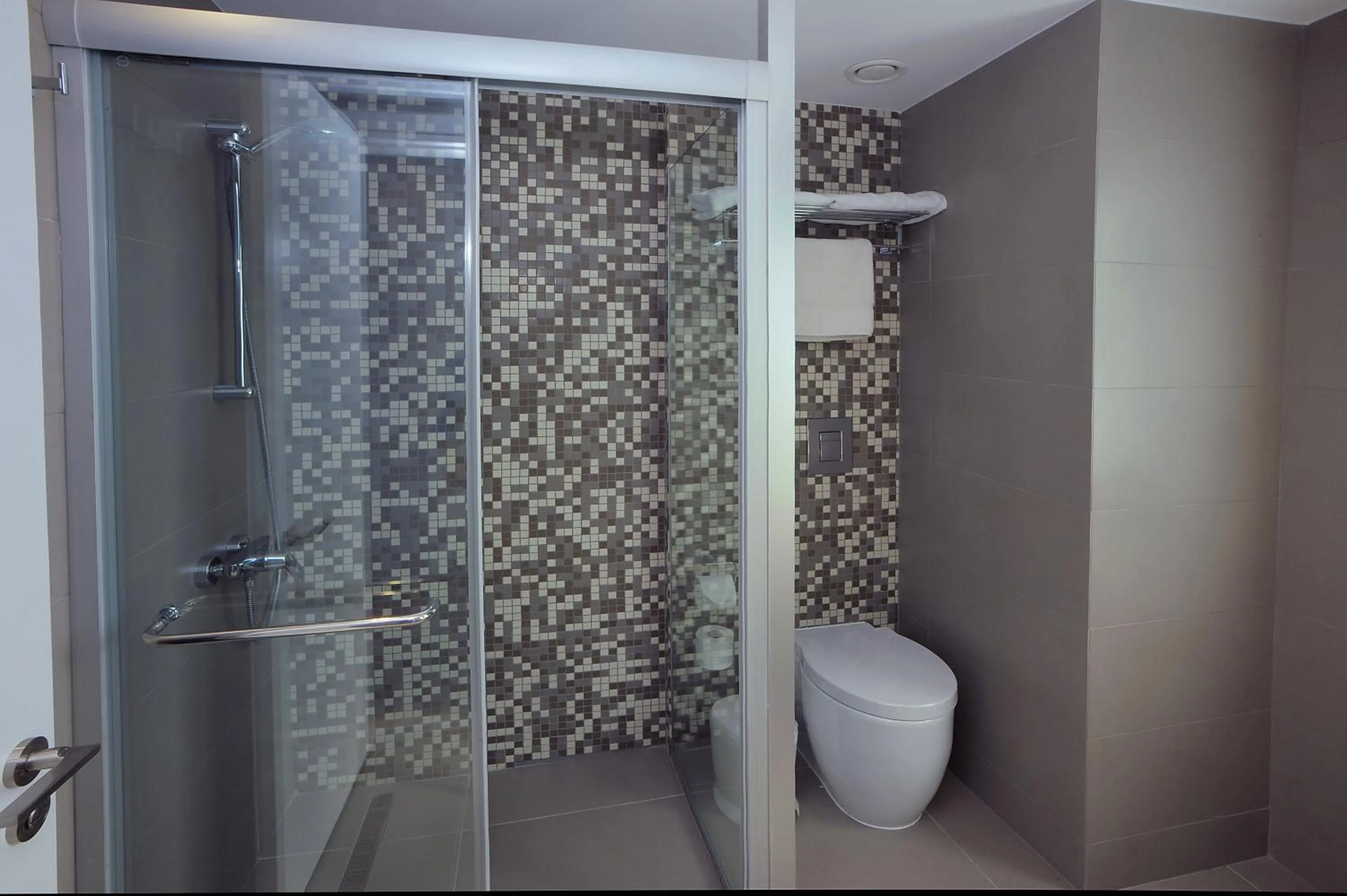 Bathroom in Okeanos Beach Boutique Hotel