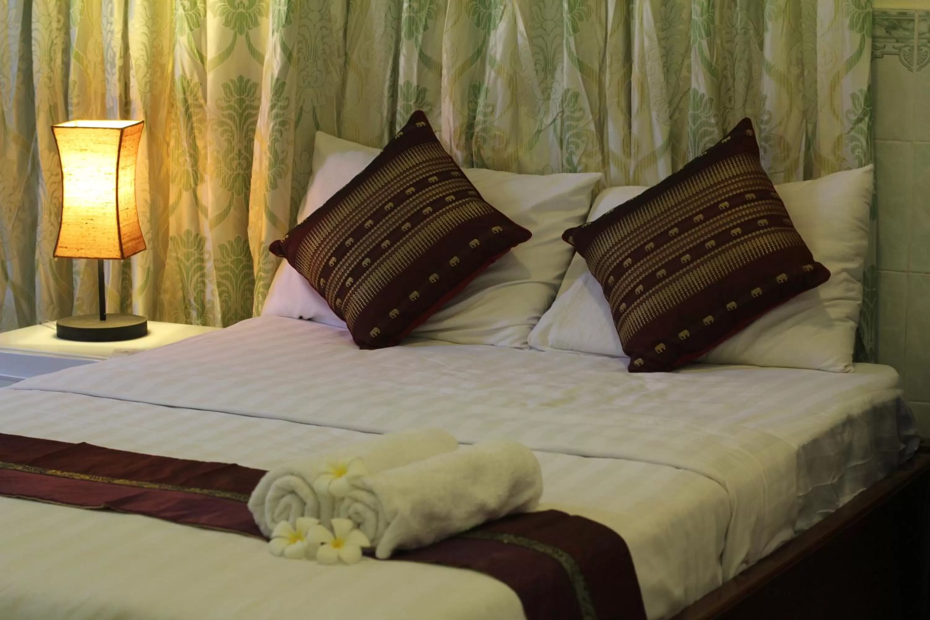 Bed in New Season Riverside Hotel