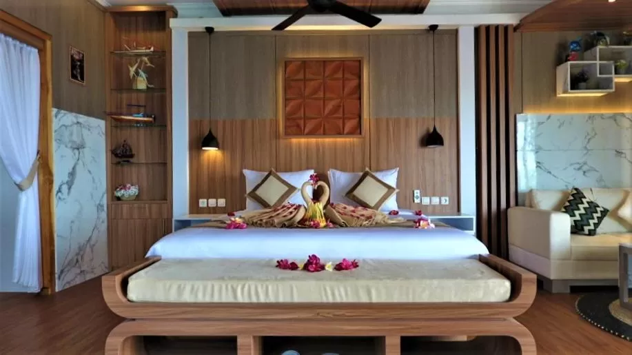 Bed in SUITE OCEAN BLUE