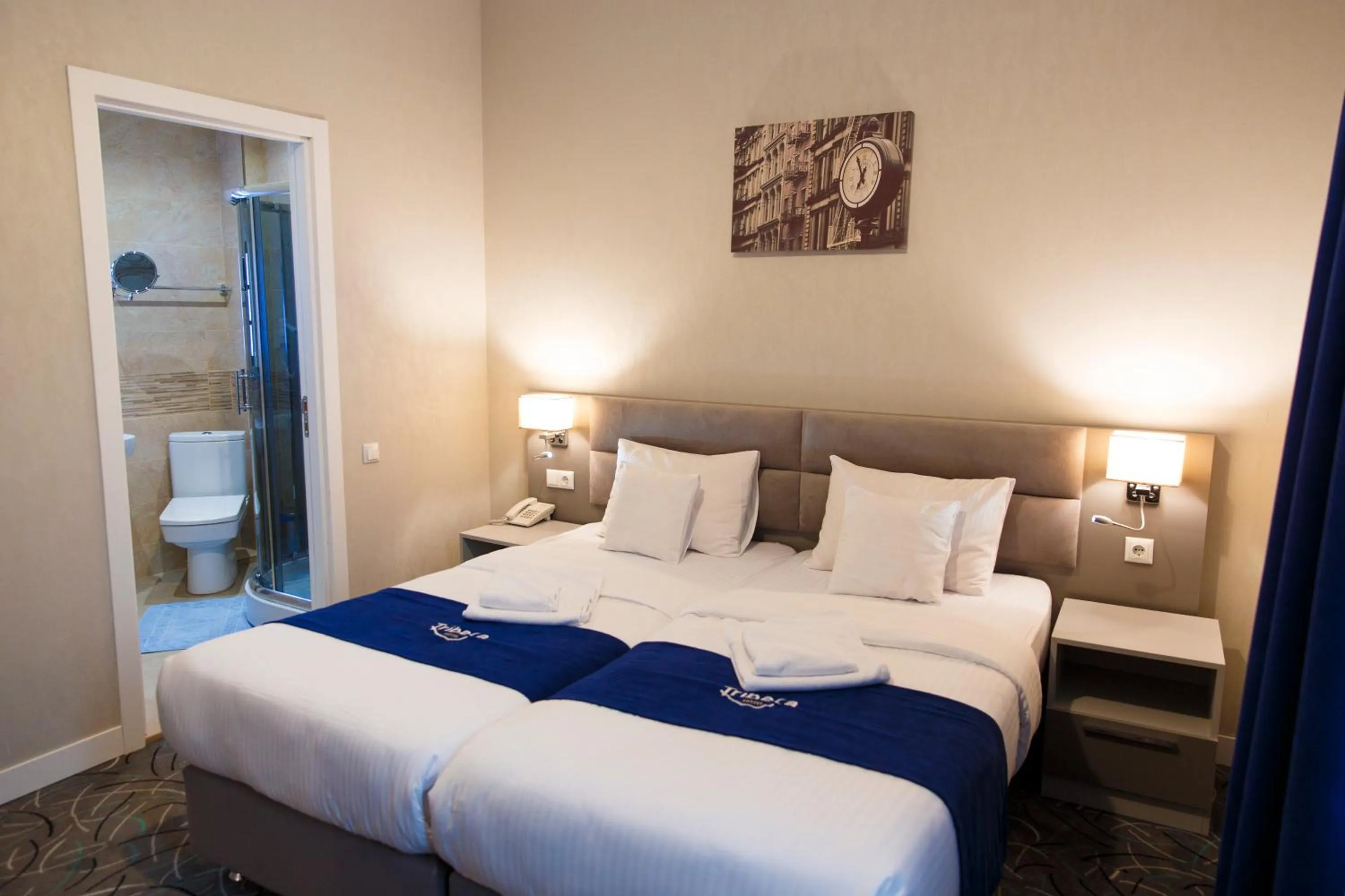 Communal lounge/ TV room in Tribeca Hotel