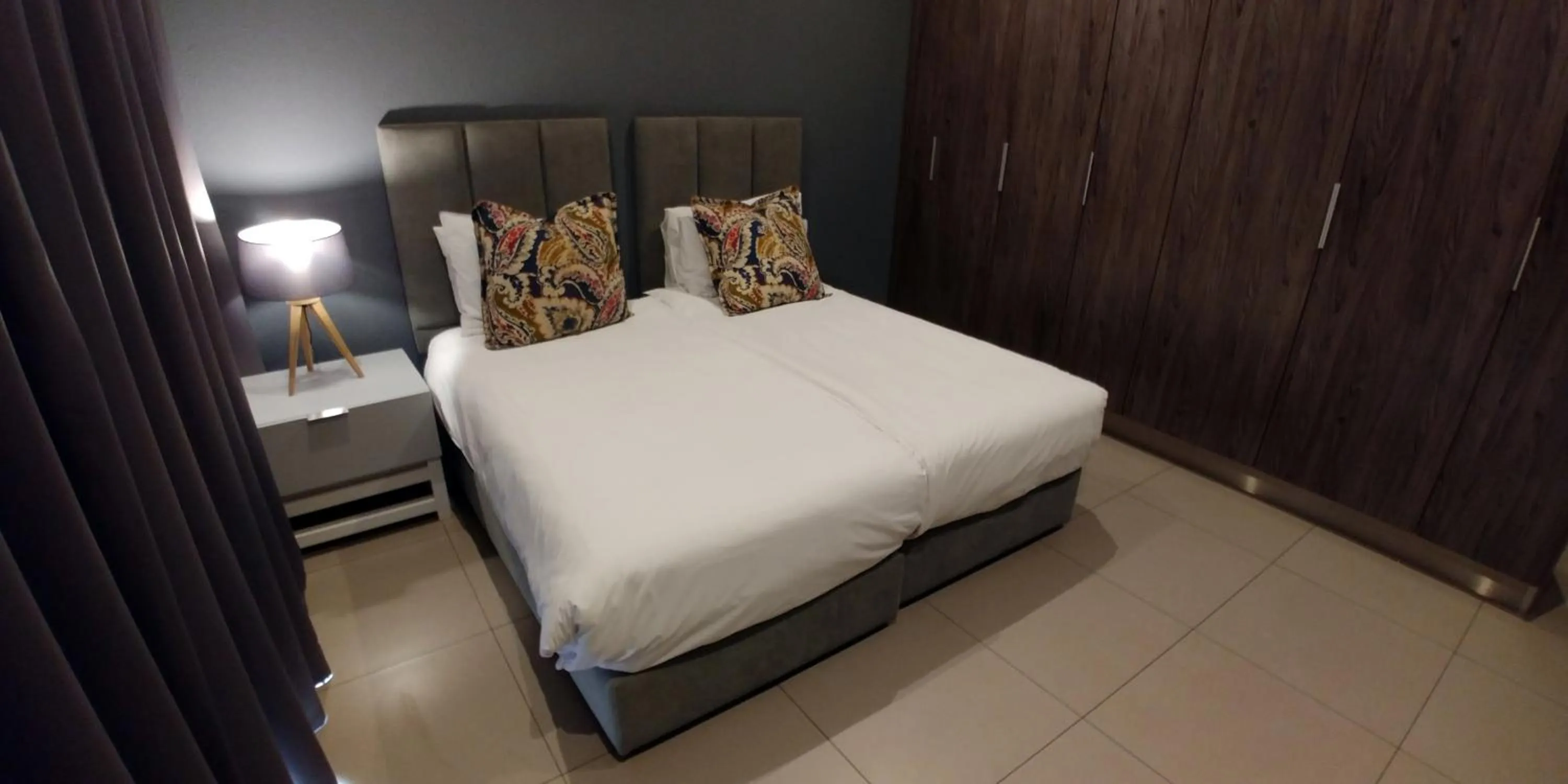 Bed in Odyssey Luxury Apartments - Back Up Generator