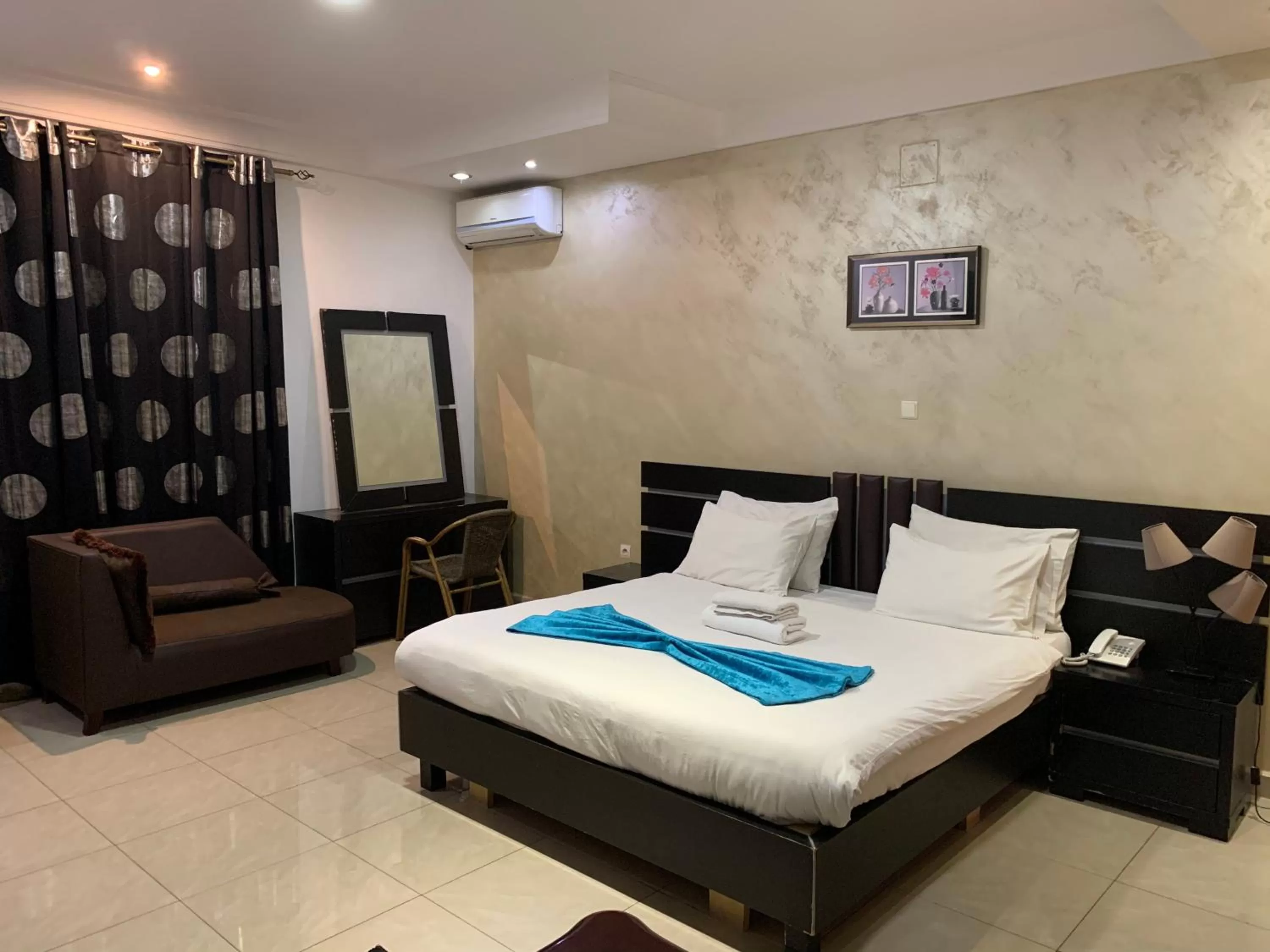 Photo of the whole room, Bed in class hotel