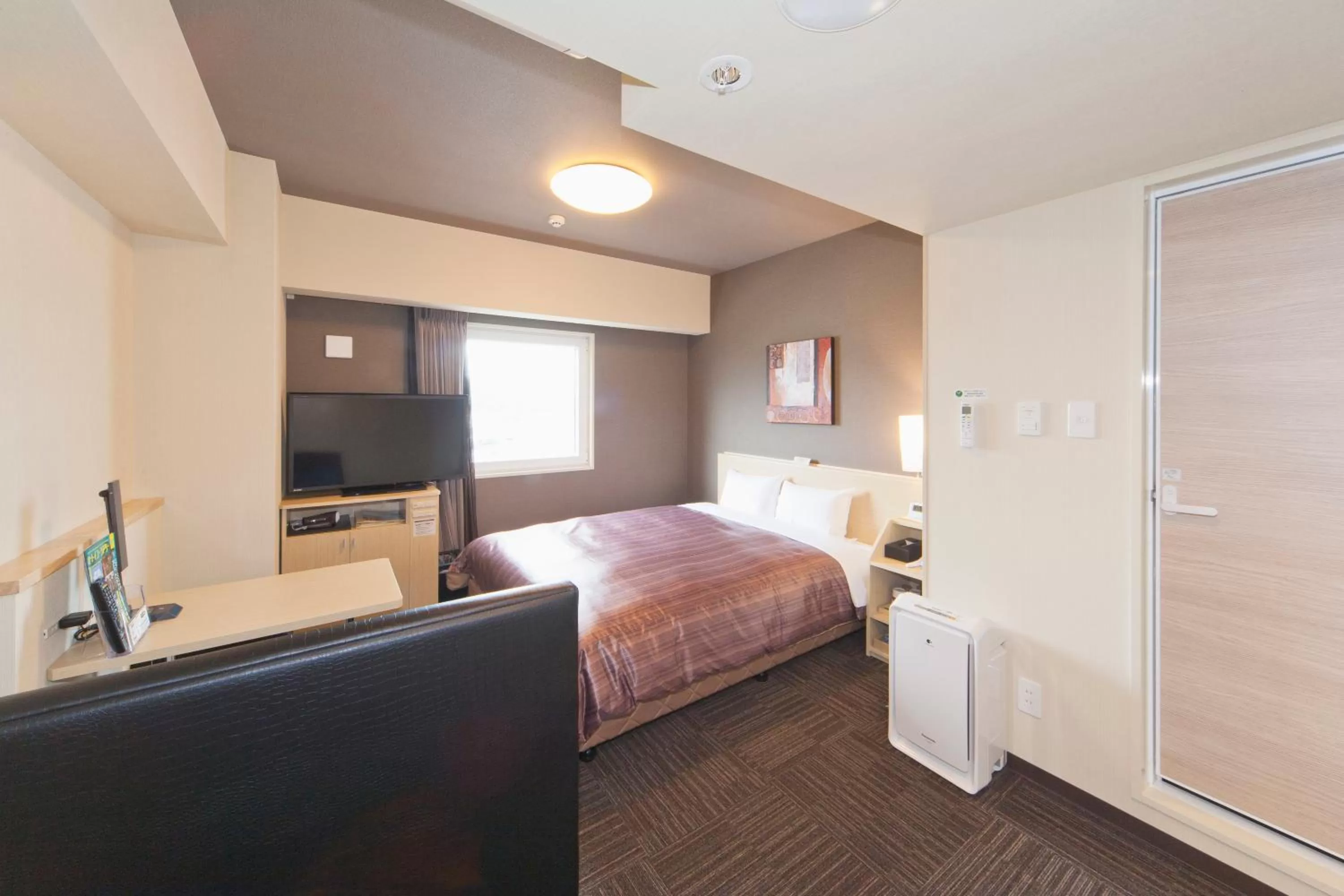 Photo of the whole room, Bed in Hotel Route-Inn Saiki Ekimae