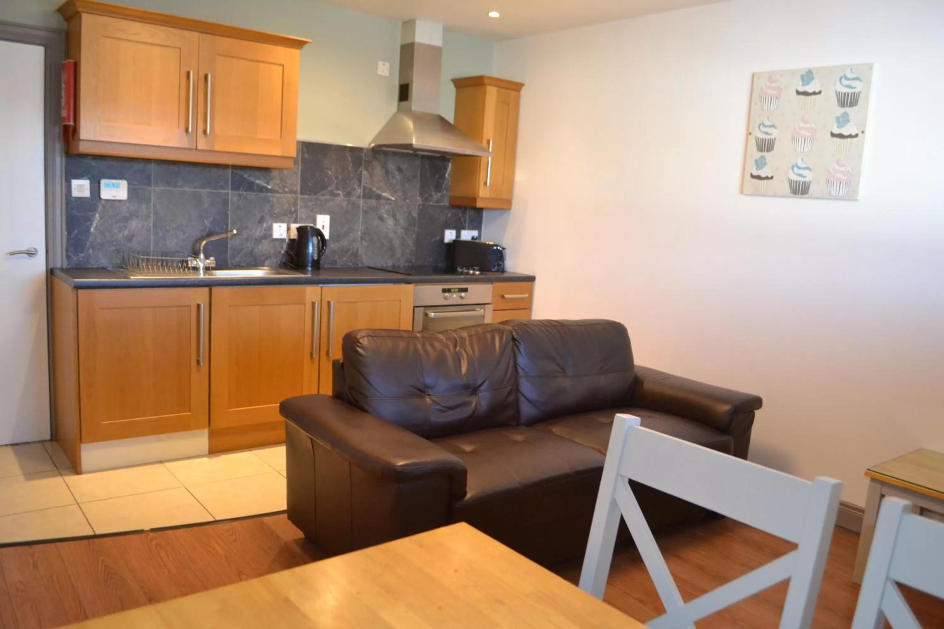 Kitchen or kitchenette in Walsh's Hotel and Apartments