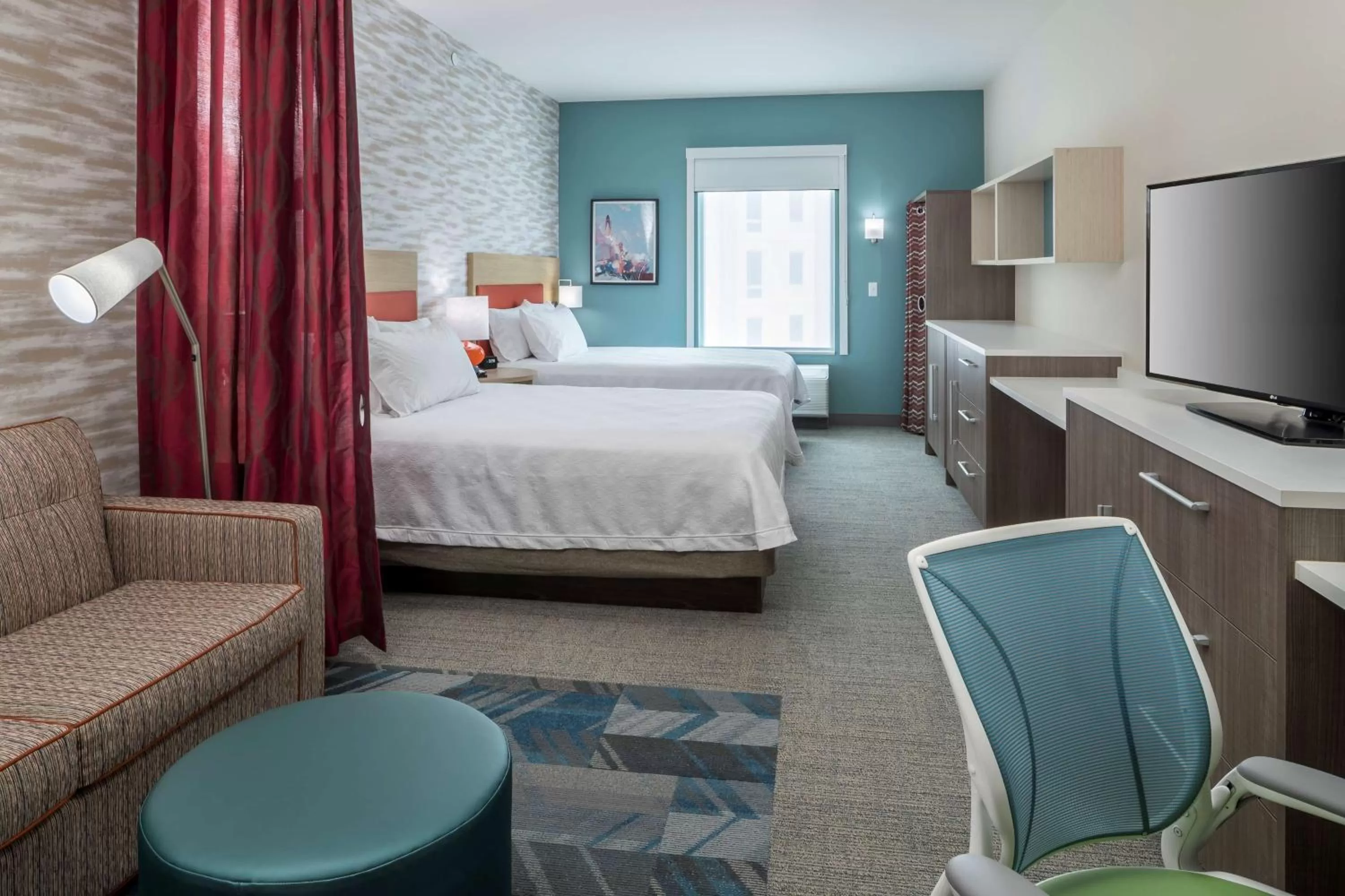 Living room, Bed in Home2 Suites By Hilton Cape Canaveral Cruise Port