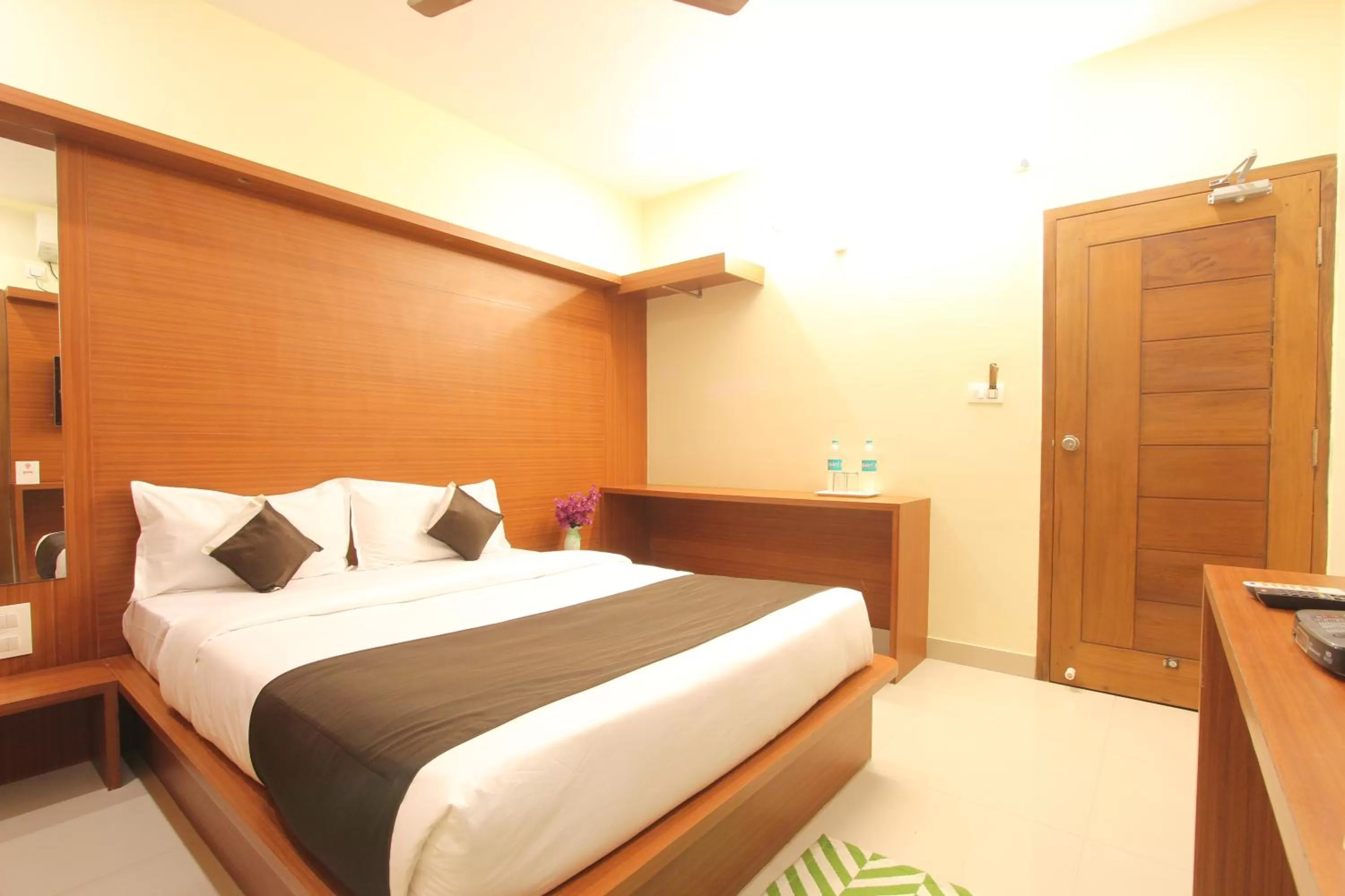 Bed in The Grand Inn Mysore