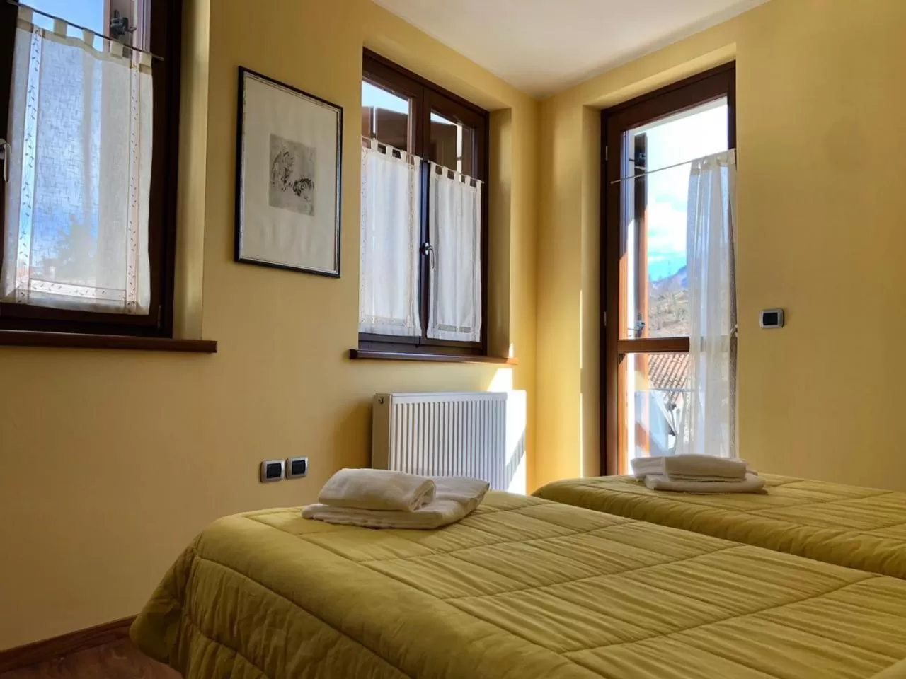 Bed in Al Fogolâr Rooms & Osteria with Saunaland