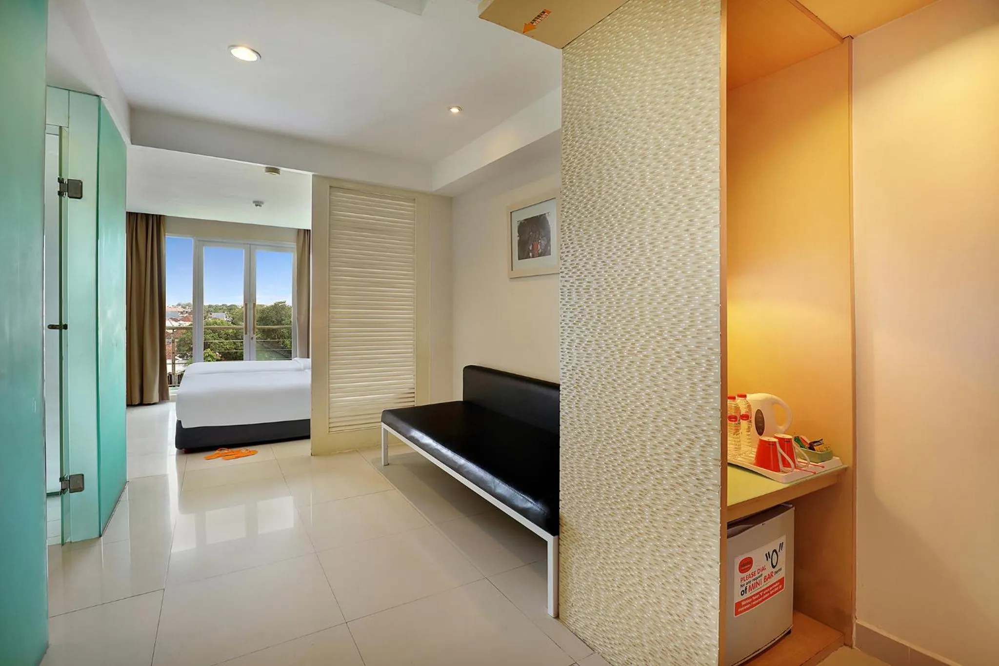 Photo of the whole room, Bed in HARRIS Hotel & Residences Riverview Kuta, Bali
