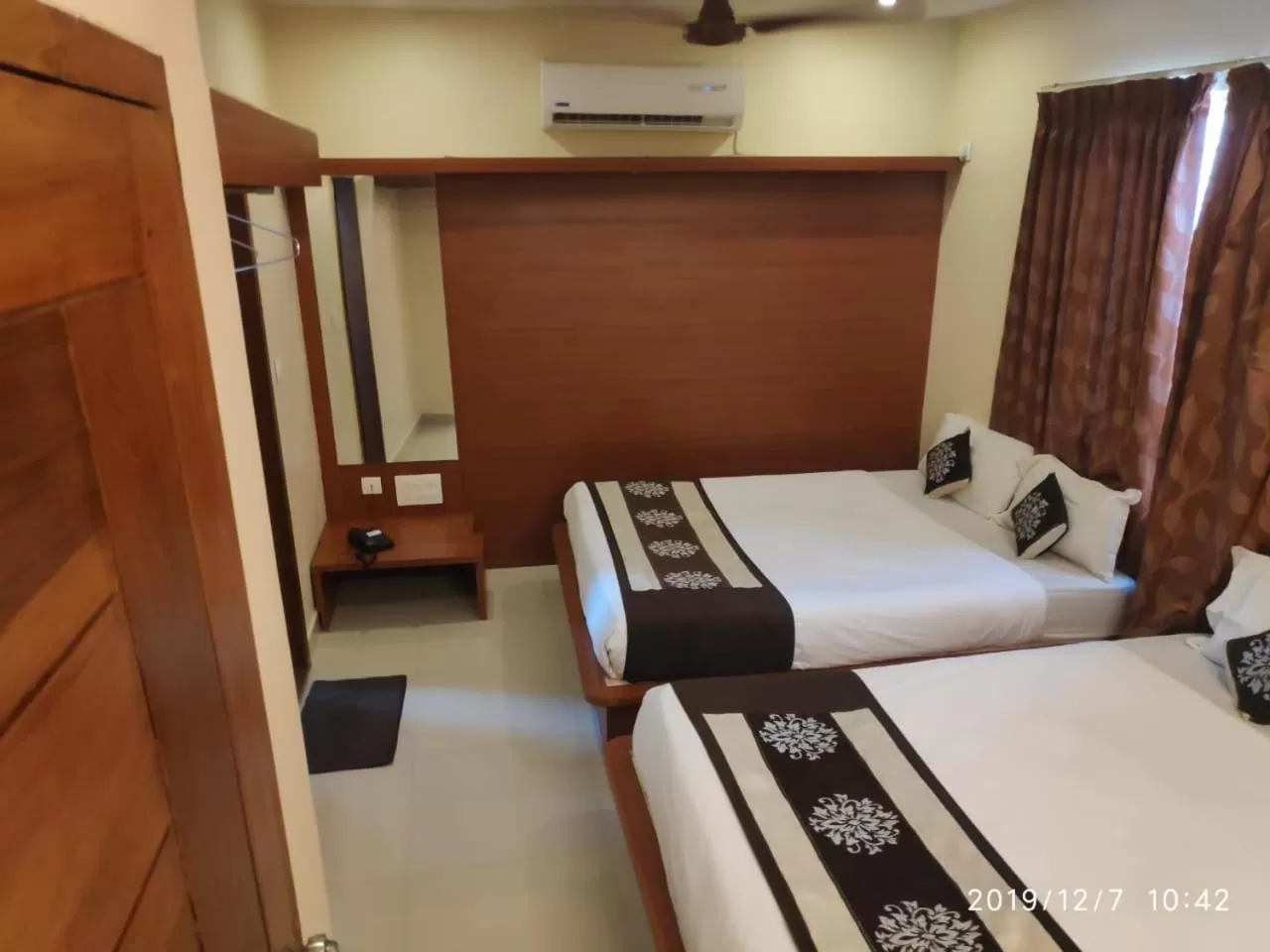 Photo of the whole room, Bed in The Grand Inn Mysore