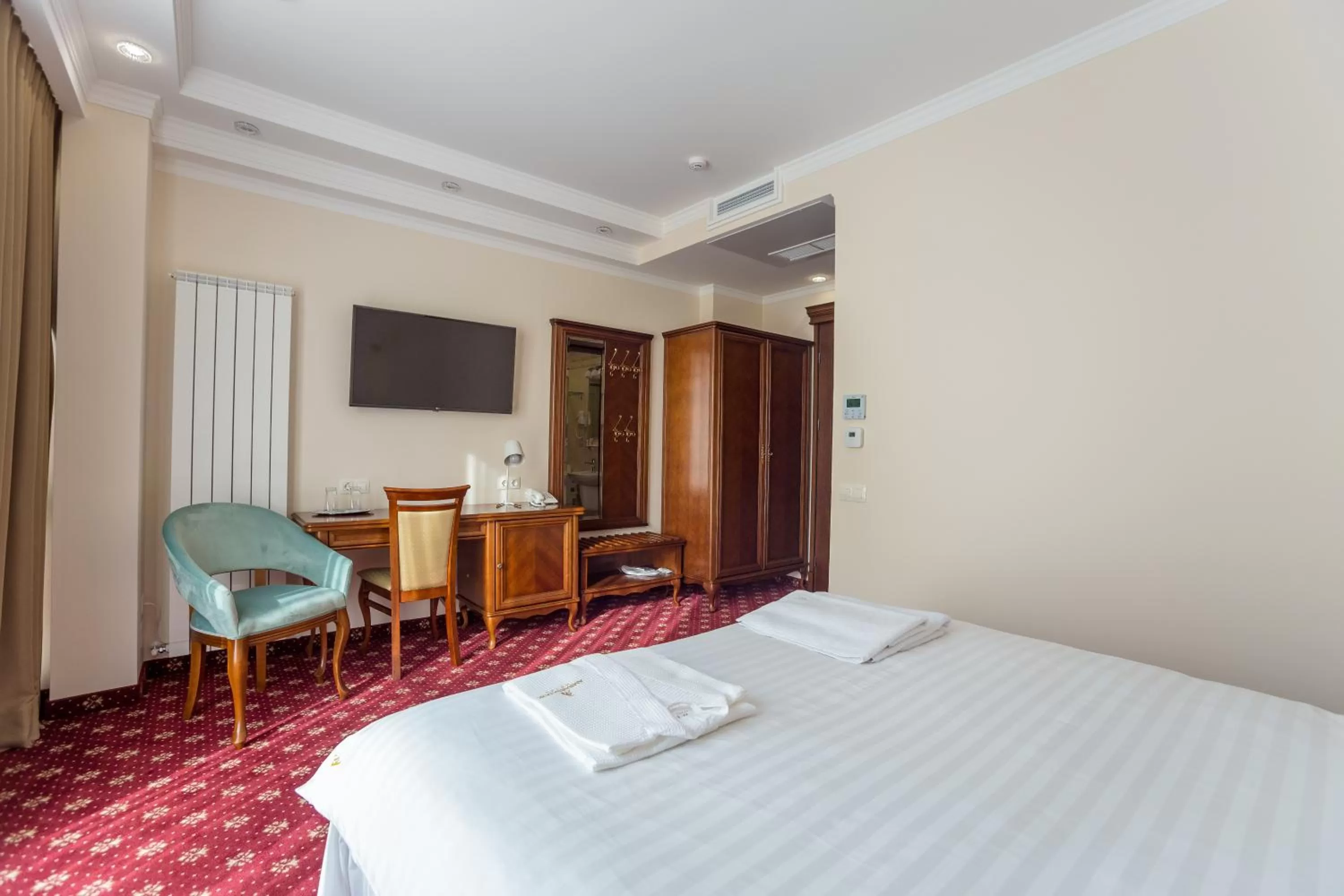 Photo of the whole room, Bed in Ambassador Hotel