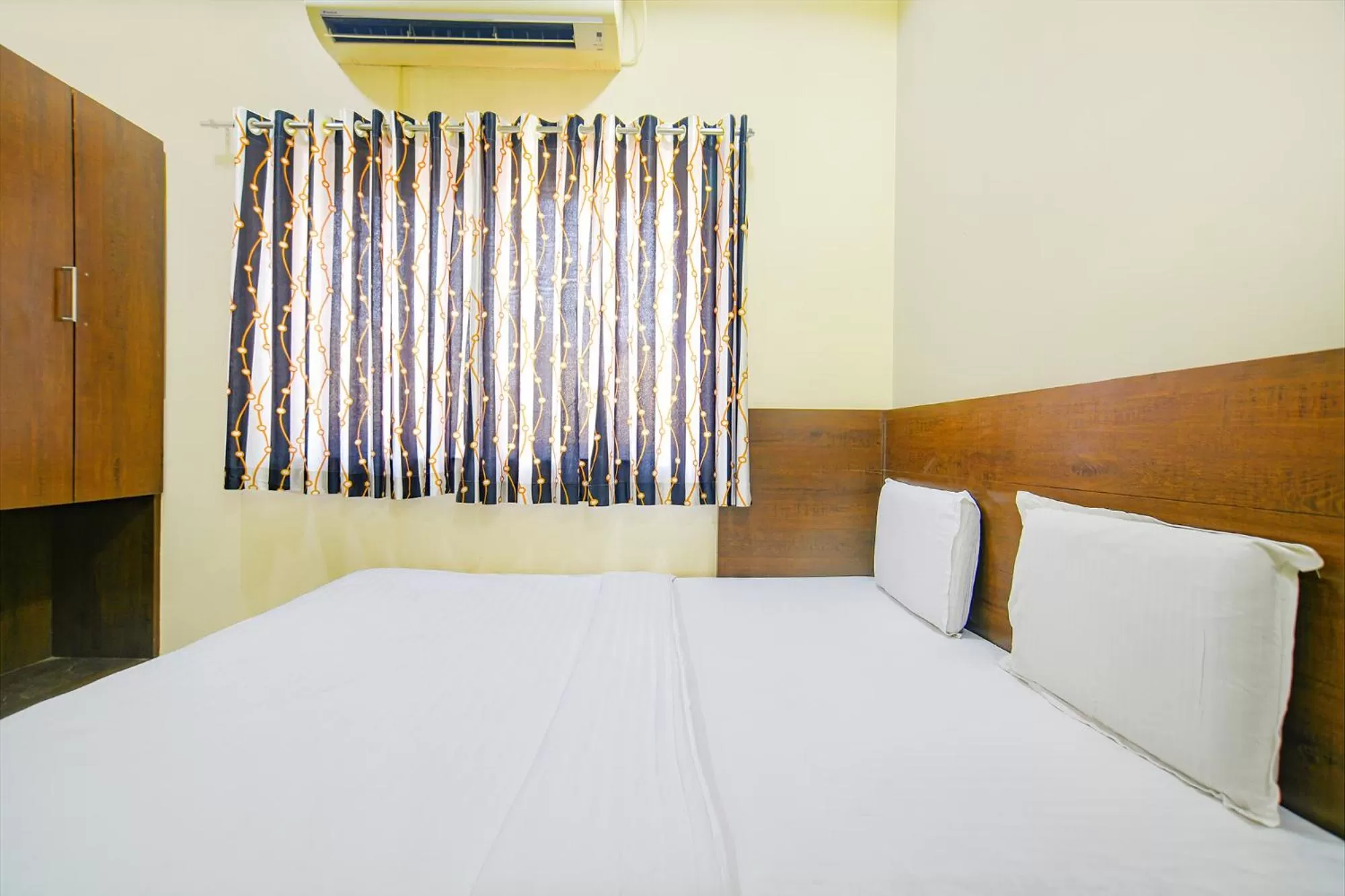 Bed in FabHotel Satyug Jaisinghpura