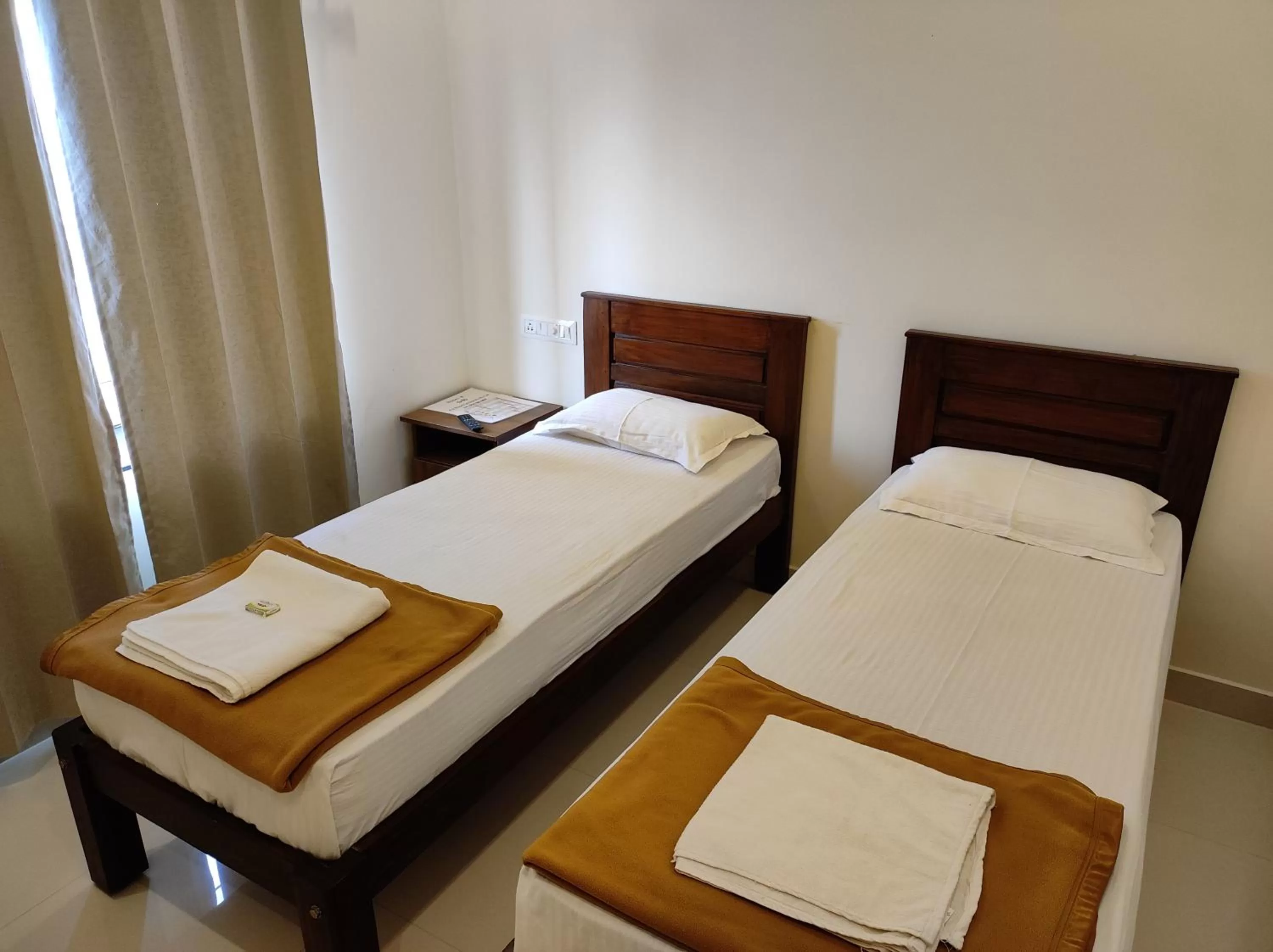 Bed in MITRA HOTELS